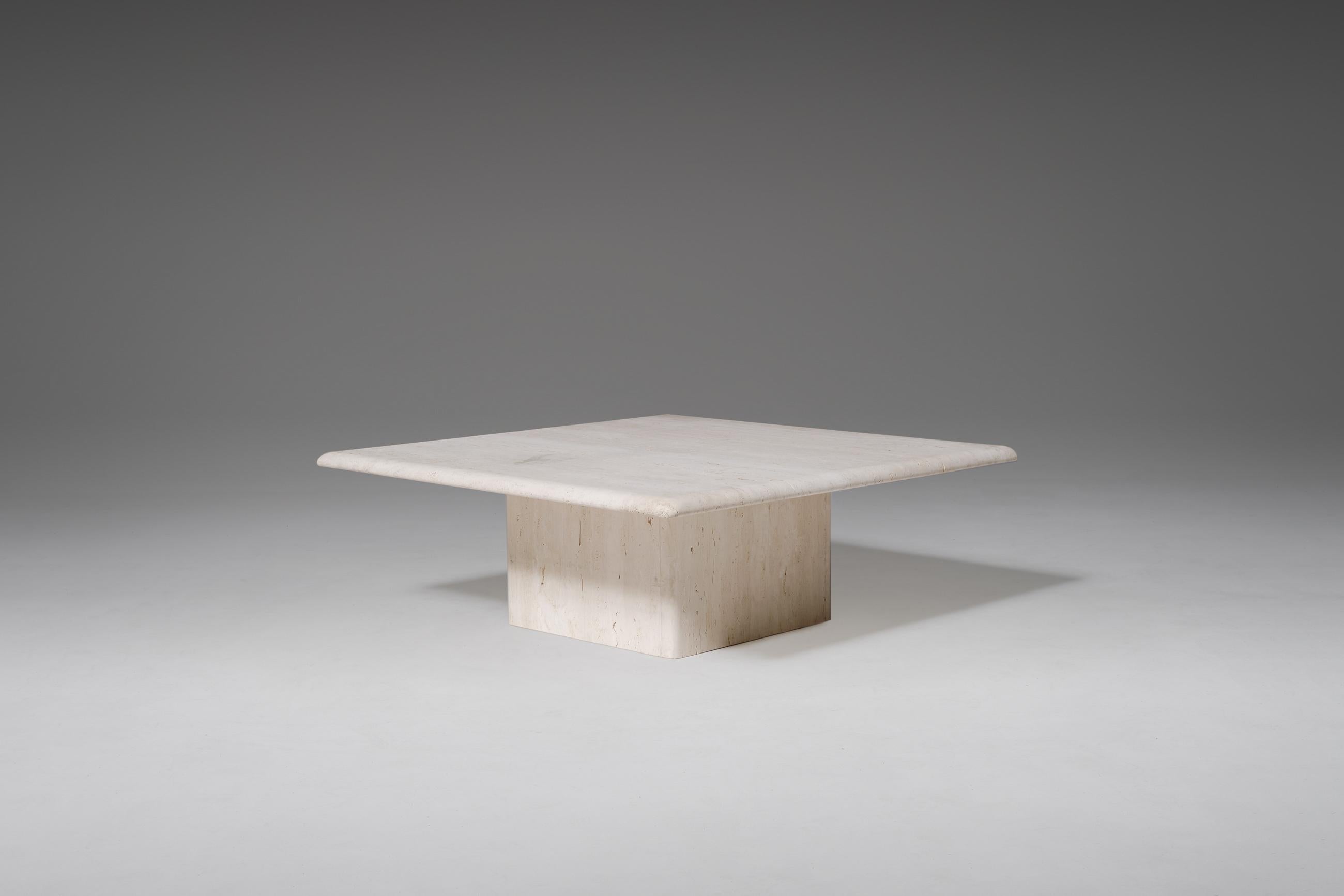 Travertine coffee table, 1970s. Heavy 3 cm thick square top with a nicely curved edge and a beautiful pattern. The top rest on a stable block base. In good condition.