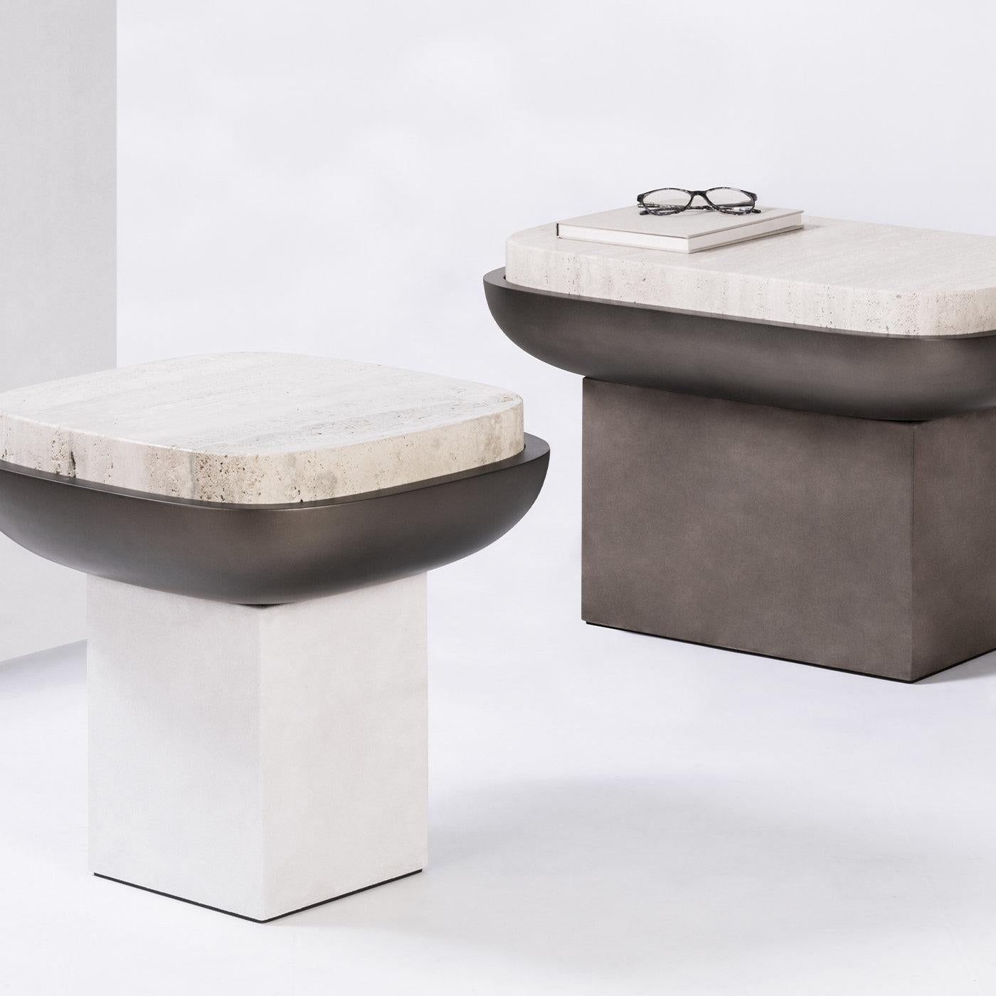Contemporary square travertine & leather side table - Olympia by Stephane Parmentier for Giobagnara.
The object presented in the image has following finish: Travertine Top, A05 White Suede Leather (base) and Bronze-laquered Wood Seat Bowl.

This