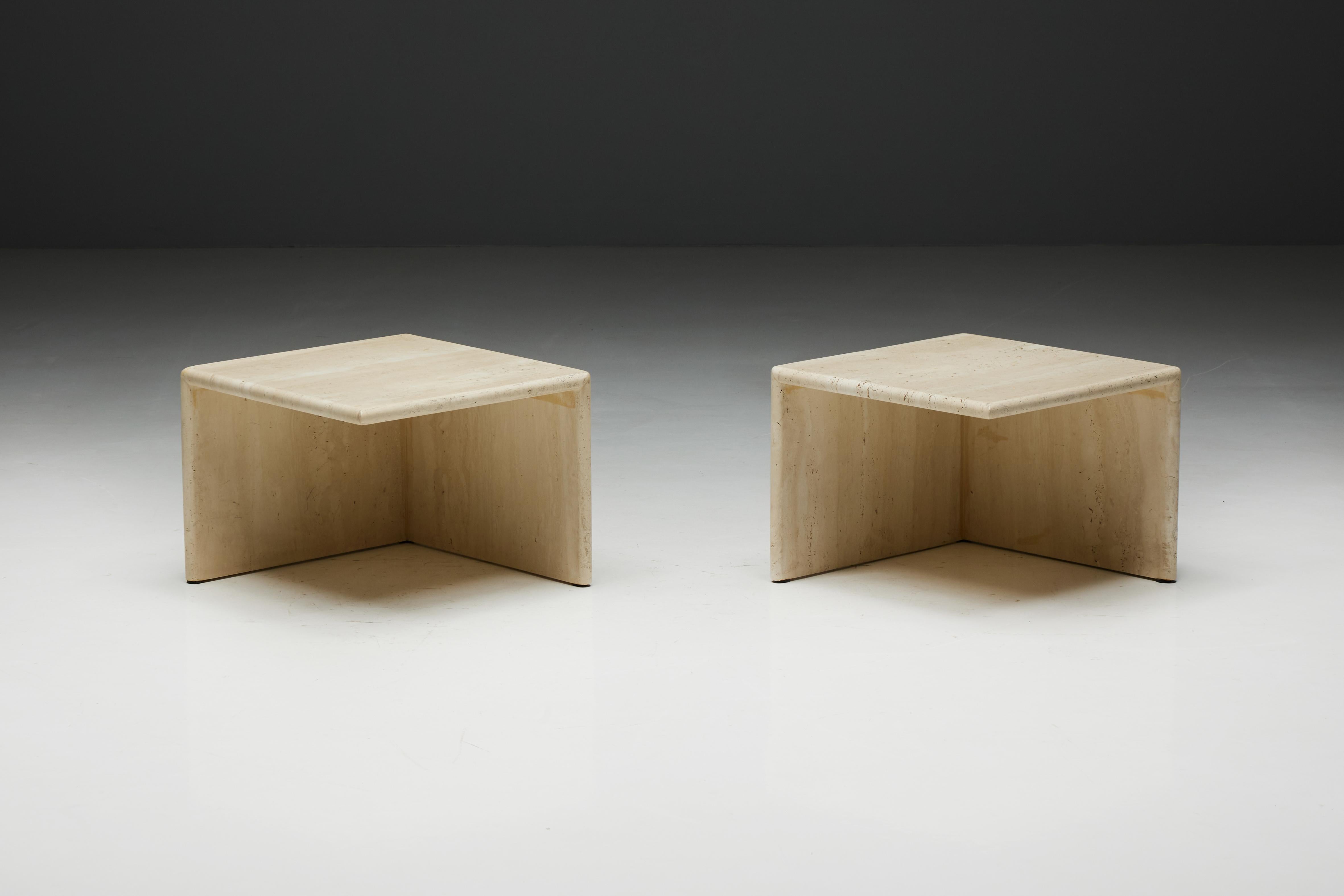 Travertine side tables, a unique design featuring a square top. These tables boast a distinctive feature, one side resembling a closed cube, while the other side is open, offering a captivating visual contrast. These unique pieces are in excellent
