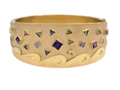 Bracciale largo con gemme multicolori dal taglio quadrato e trilione in oro 14 carati