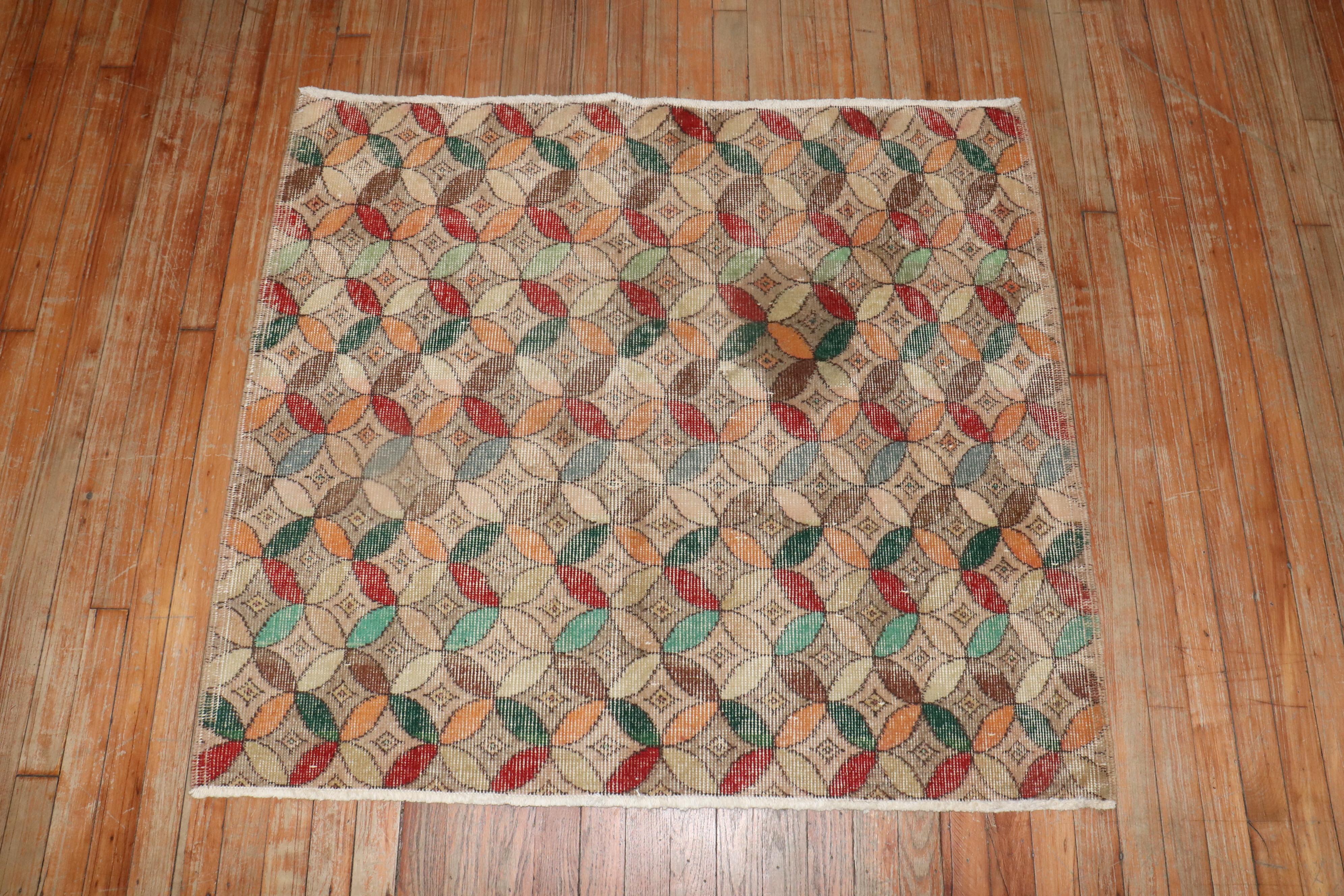 Small square size Turkish deco rug with a repetitive circular motif throughout in array of colors.

Measures: 3'7'' x 4'.