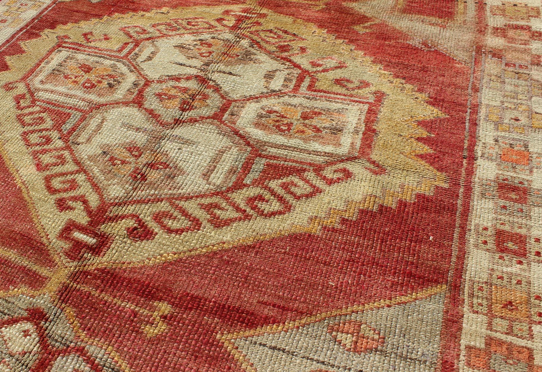 Mid-20th Century Square Turkish Oushak with Medallion Design in Muted Red, L. Green & Yellow For Sale