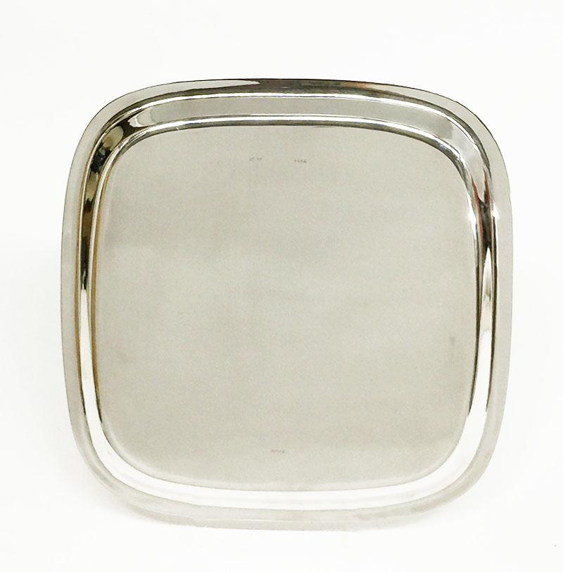 Square two rimmed silver tray by M.H. Wilkens & Söhne, Germany

Early 20th century, 835/000 silver tray by Wilkens & Söhne, est. 1810 in Bremen
Marked with the Hallmark spindel press of Wilkens and the Dutch Silver Hallmark ZII and Silversmith