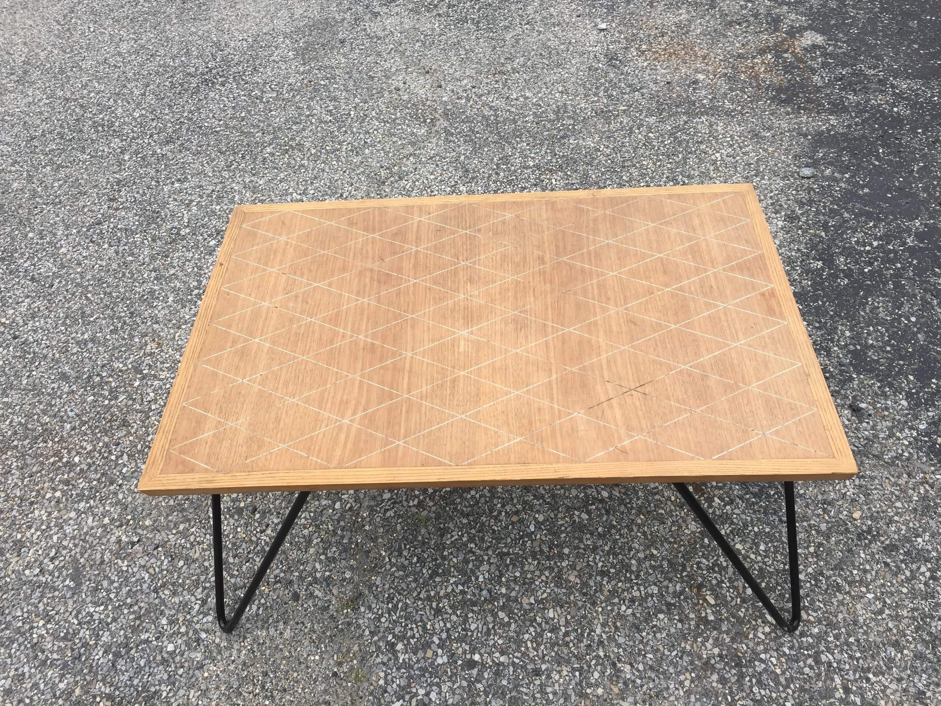 Mid-Century Modern coffee table with wire legs and beautiful wood work in diamond shape pattern.