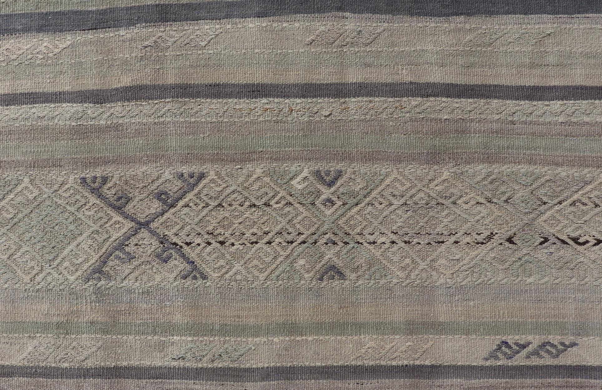 Square size vintage Turkish Kilim in dark blue, L. green, gray, Taupe . Keivan Woven Arts / rug EN-P13449, country of origin / type: Turkey / Kilim, circa Mid-20th Century.

Measures: 5'10 x 6'1

This flat-woven Kilim from Turkey features an