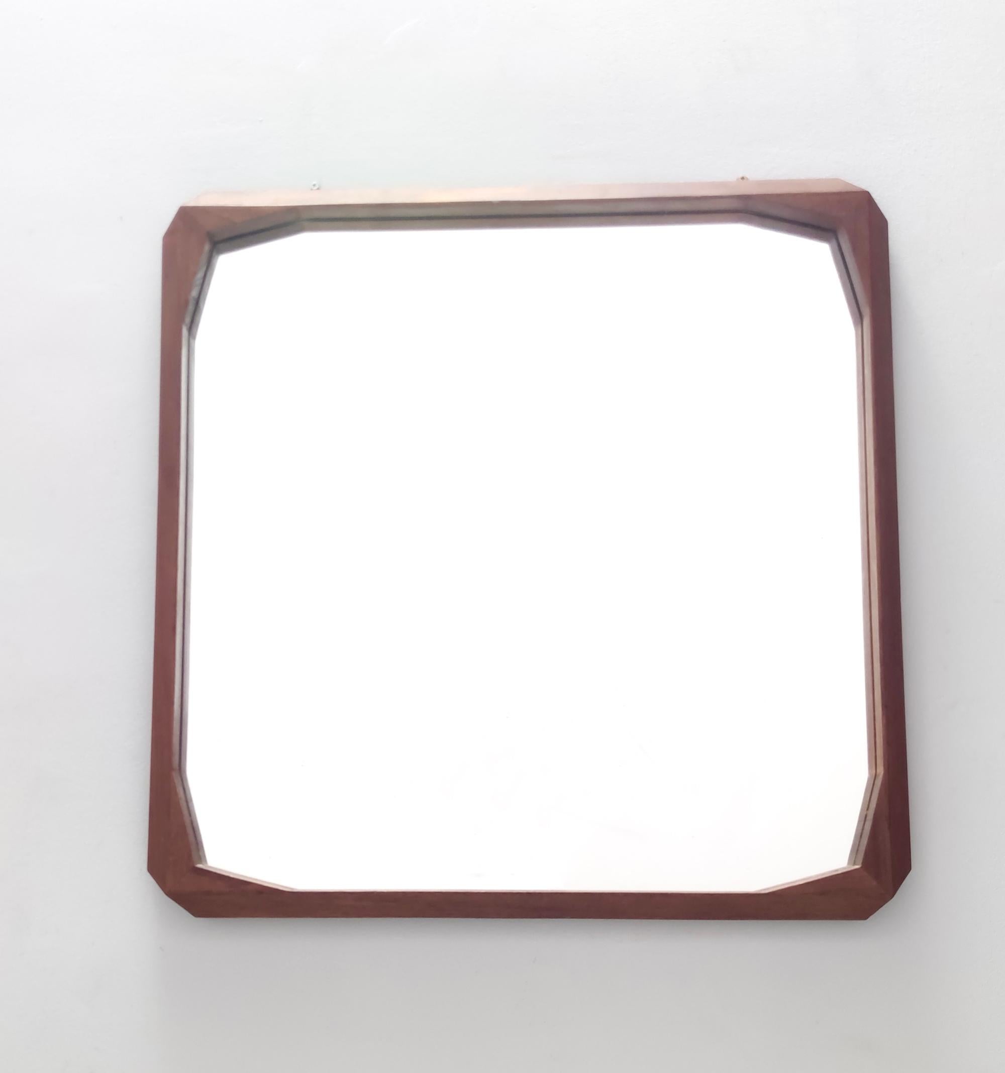 Made in Italy, 1960s.
It features a square ebonized walnut frame.
This mirror is a vintage piece, therefore it might show slight traces of use, but it can be considered as in very good original condition and ready to become a piece in a