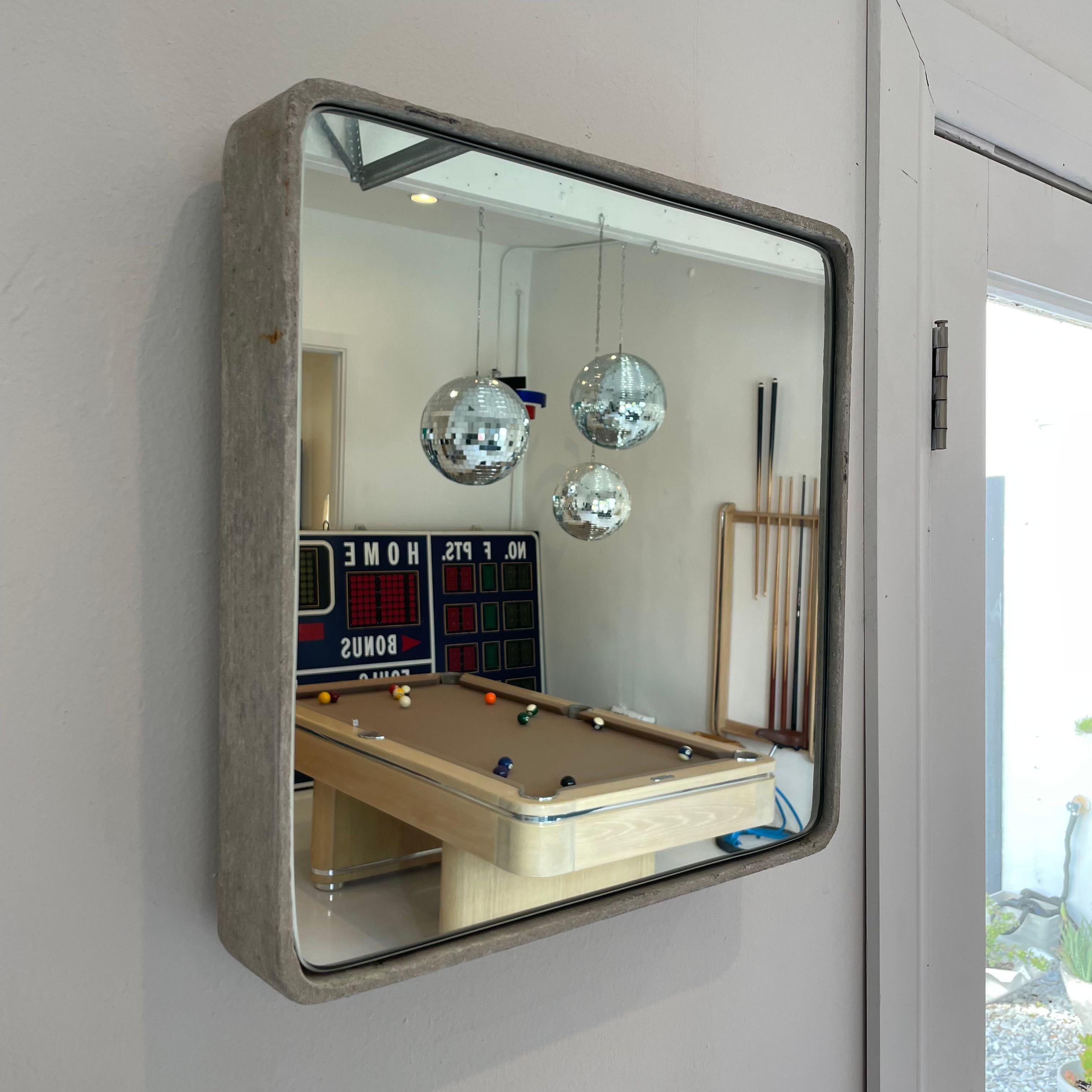 Beautiful square Willy Guhl concrete mirror. Concrete vessel originally produced at the Eternit factory in Switzerland in the 1960’s and mirror was professionally hand cut and added recently. Beautiful patina as expected with age featuring myriad of