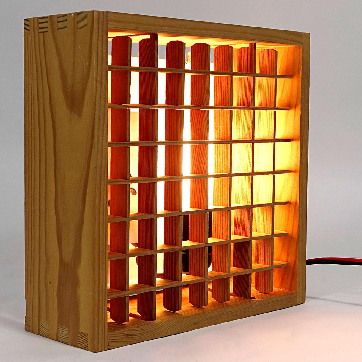 Rare ceiling light made of wood with a steel base that is attached to the ceiling. The joints in the wood construction well visible. It has a wooden grid containing 64 squares allowing for a subtle direction of the light coming out.