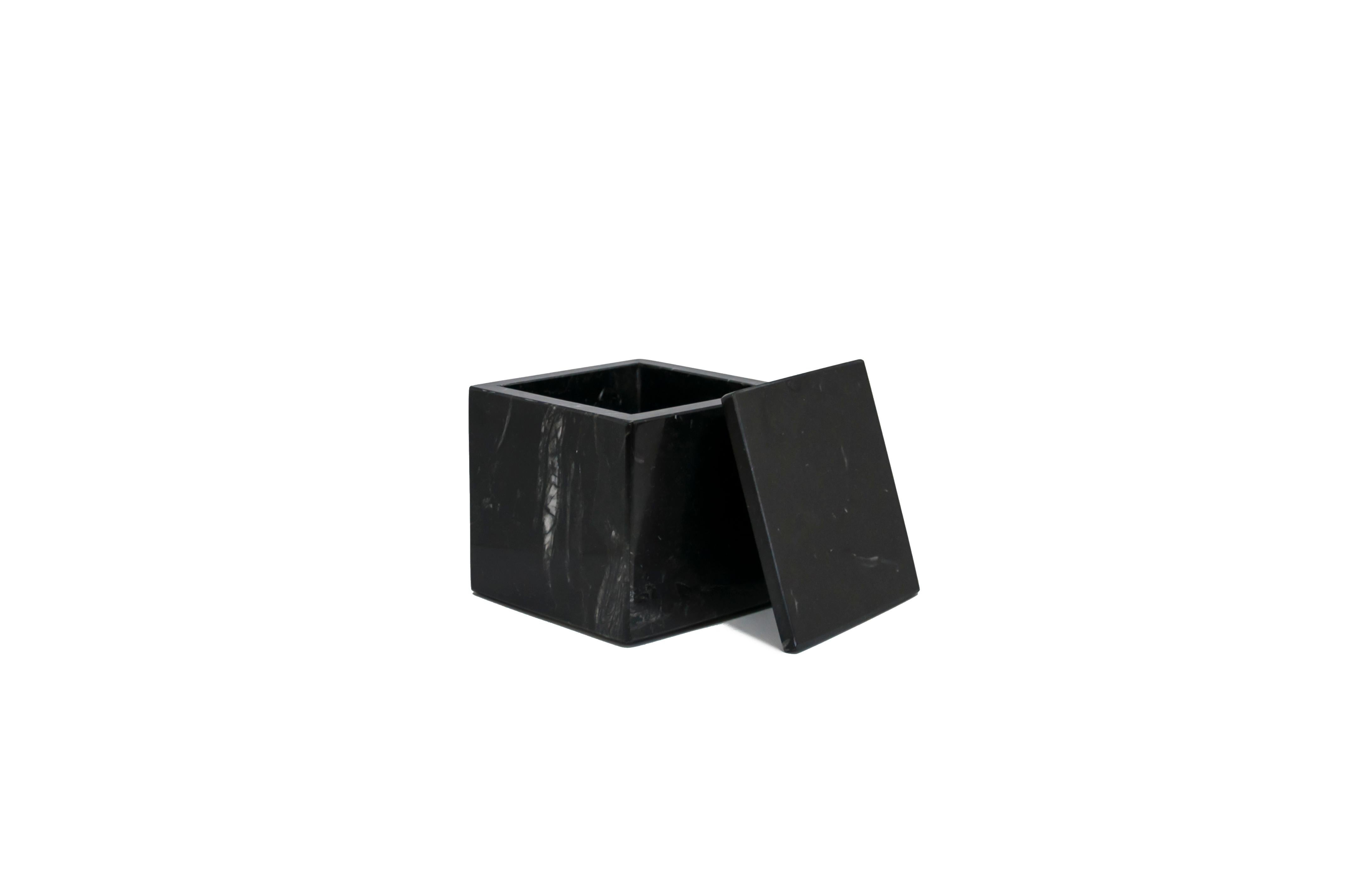 Squared black Marquina marble box with lid.
Each piece is in a way unique (since each marble block is different in veins and shades) and handcrafted in Italy. Slight variations in shape, color and size are to be considered a guarantee of an