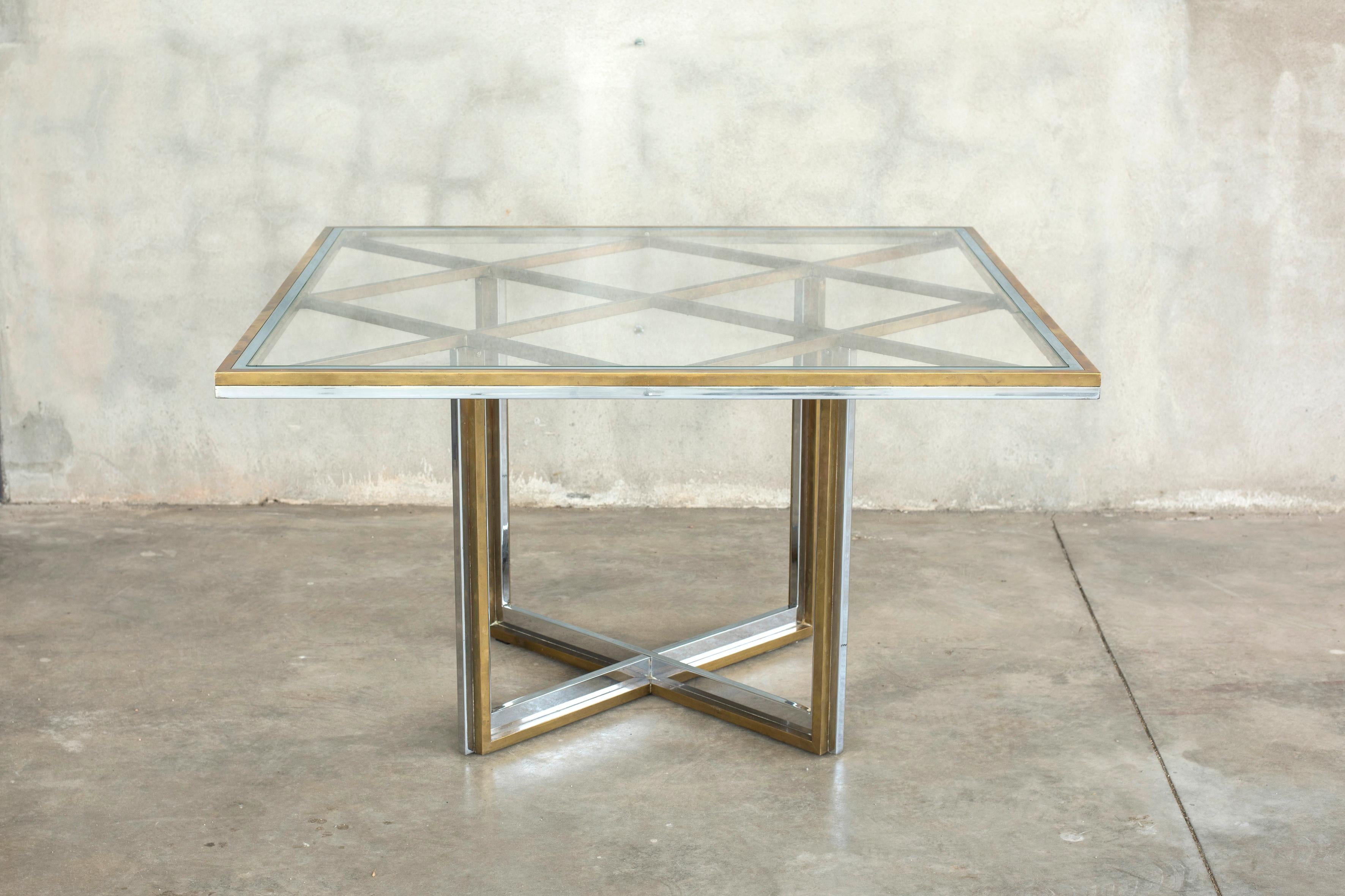 Squared brass and chromed steel crystal tempered top table Romeo Rega style
Italy 1960s manner of Crespi and Rega designers.
Very charming table both for kitchens and foyers. 
Size 140 x 140 cm H 72 cm
A video is available upon request.
New