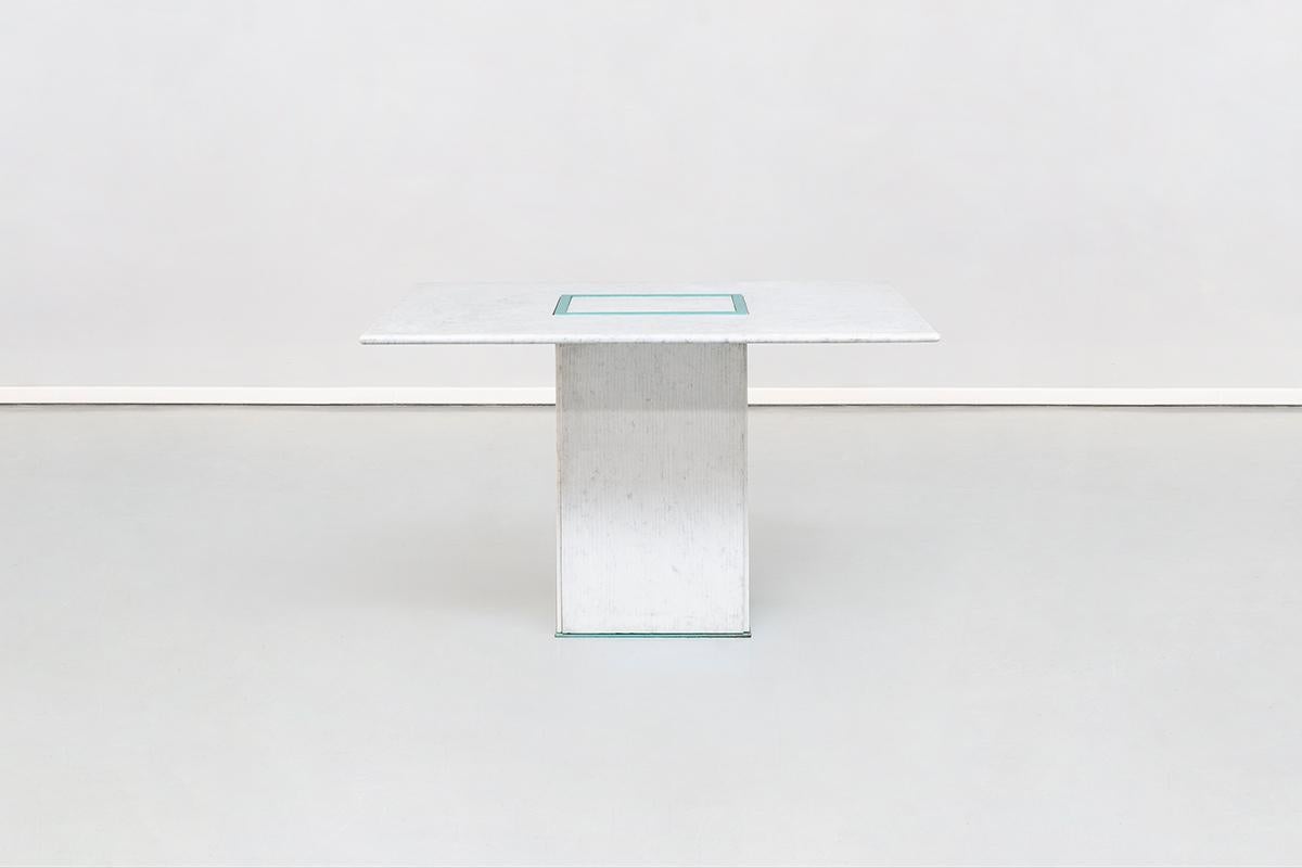 Squared dining marble table by Gianfranco Frattini, 1985
Absolute masterpiece by Gianfranco Frattini coming from his private house in Italy. This sculptural table is composed by a squared blue metal basement where, on each side, a ruled marble slab