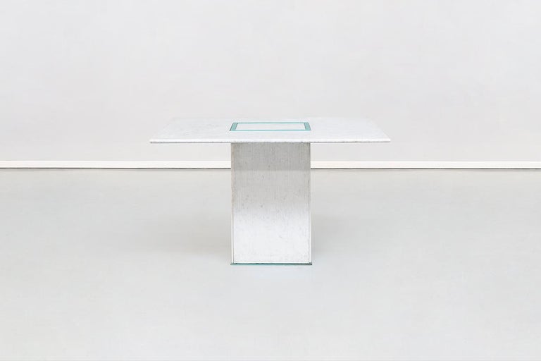 Squared dining marble table by Gianfranco Frattini, 1985
Absolute masterpiece by Gianfranco Frattini coming from his private house in Italy. This sculptural table is composed by a squared blue metal basement where, on each side, a ruled marble slab
