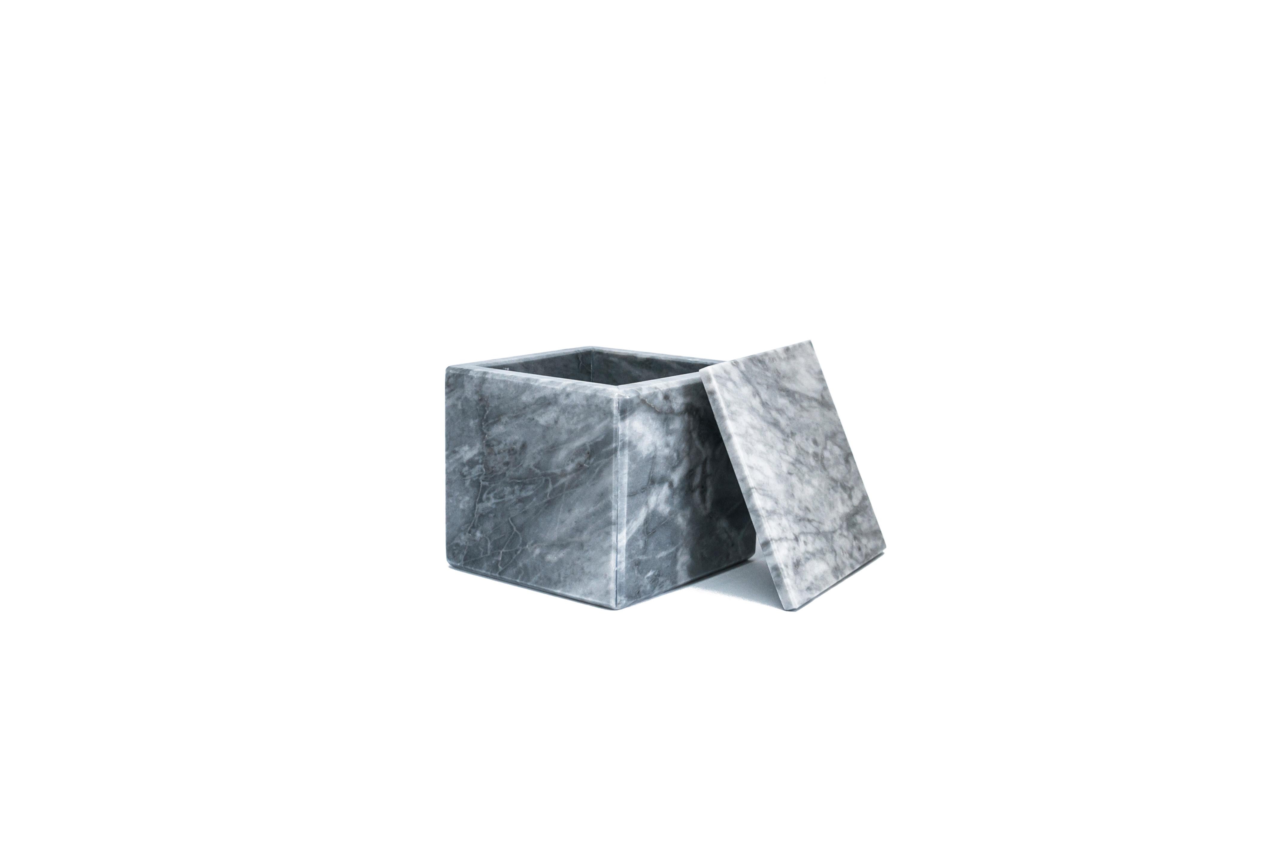 Squared grey Bardiglio marble box with lid.
Each piece is in a way unique (since each marble block is different in veins and shades) and handcrafted in Italy. Slight variations in shape, color and size are to be considered a guarantee of an