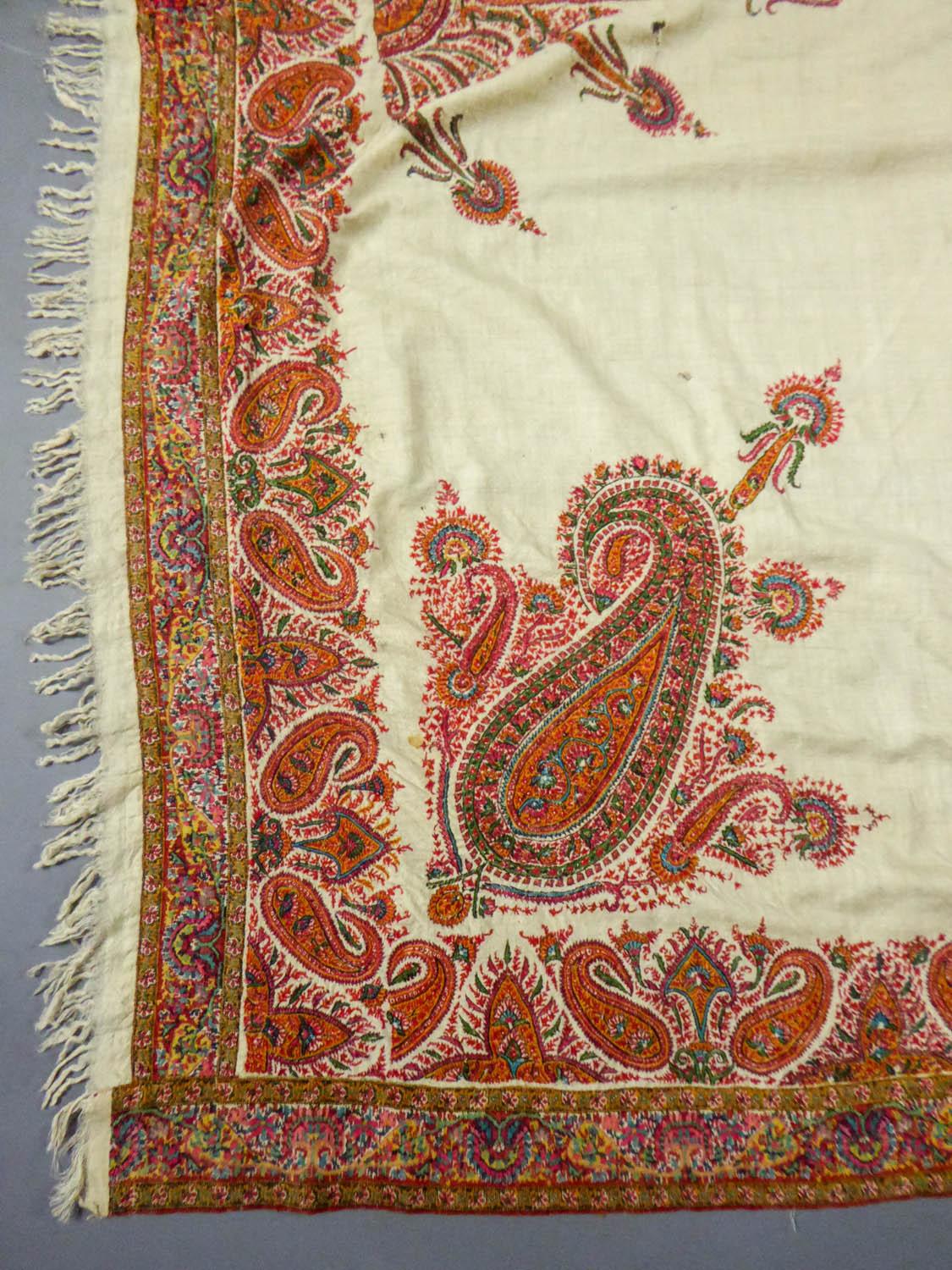 Circa 1870
India

Indian kashmir shawl embroidered with silk called Amli shawl and dating from the second half of the nineteenth century. Background in very fine  very silky pashmina densely embroidered in the corners and a star in the center.