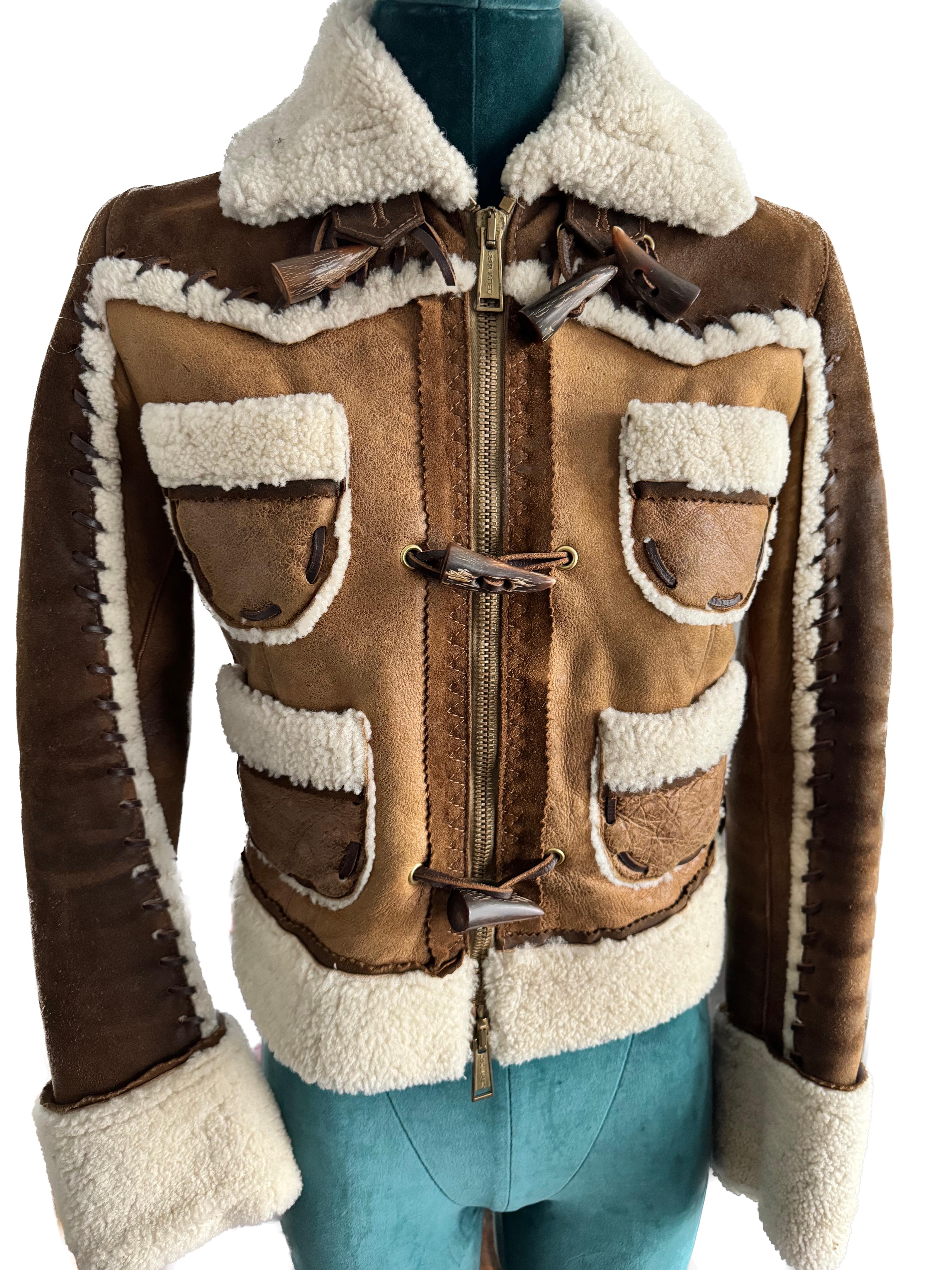 he Dsquared shearling short jacket embodies a luxurious and meticulously crafted design, featuring exquisite details that elevate its style and sophistication.

Crafted from high-quality shearling, this short jacket boasts a plush and cozy texture,