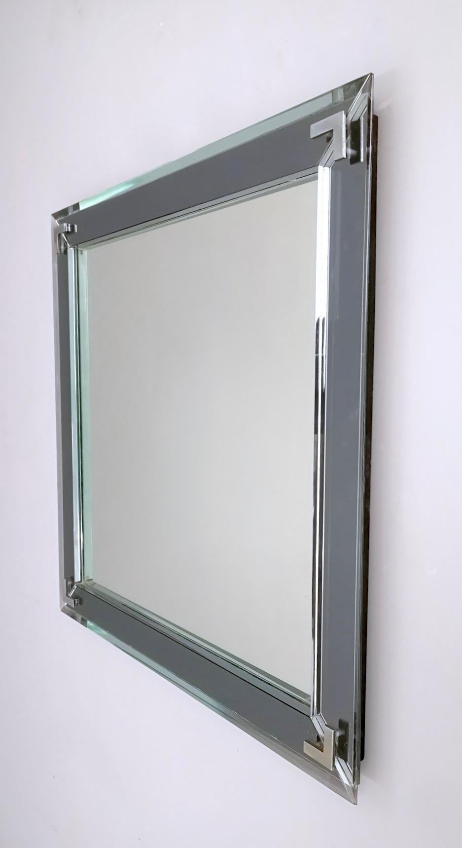 Made in Italy, 1960s. 
Made in mirror, glass and metal.
It might show slight traces of use since it's vintage, but it can be considered as in perfect original condition and ready to become a piece in a home.

Measures: Width 65 cm
Depth 3.5
