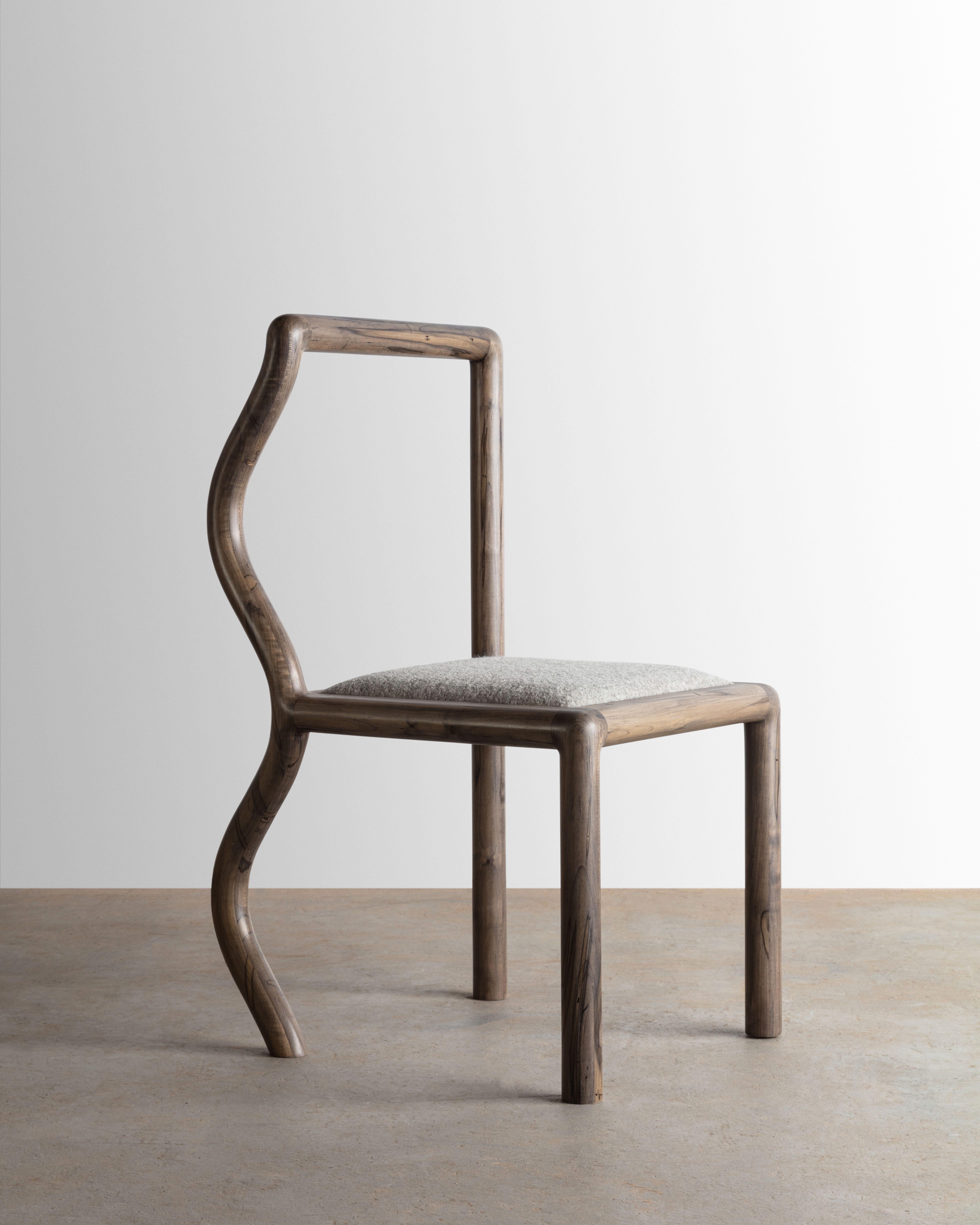 The Squiggle chair was created through an exploration of shaping solid slab lumber. Designed to bring a smile to any space, each chair part is thoughtfully selected to highlight the grain pattern and characteristics of wormy maple. The seat is