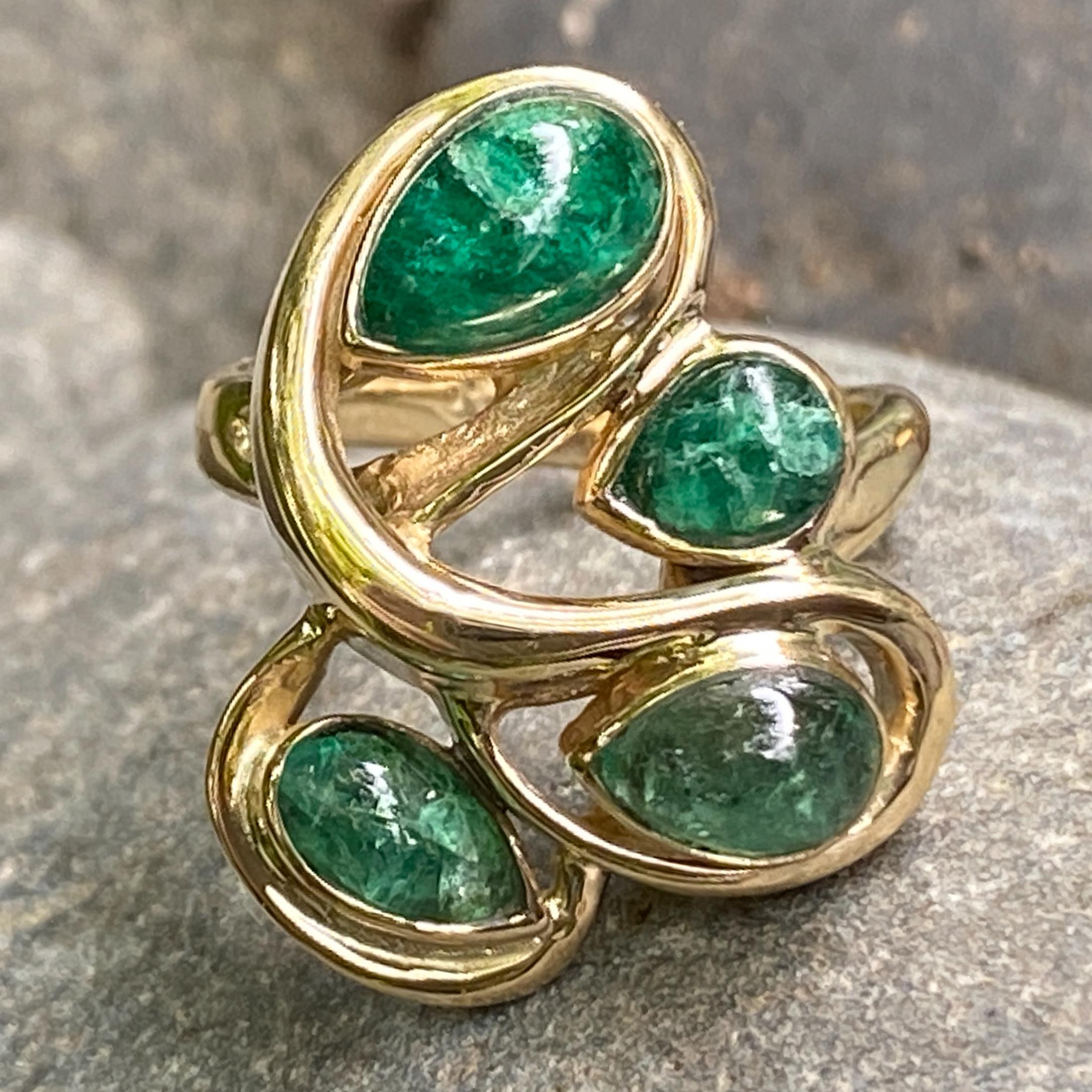 This ring was born in the 1970s and was a popular, ubiquitous style at the time.  Ours was originally set with some very sad and uninspired white (aka precious) opals.  When we gazed upon this ring, we felt as sad and uninspired as those boring