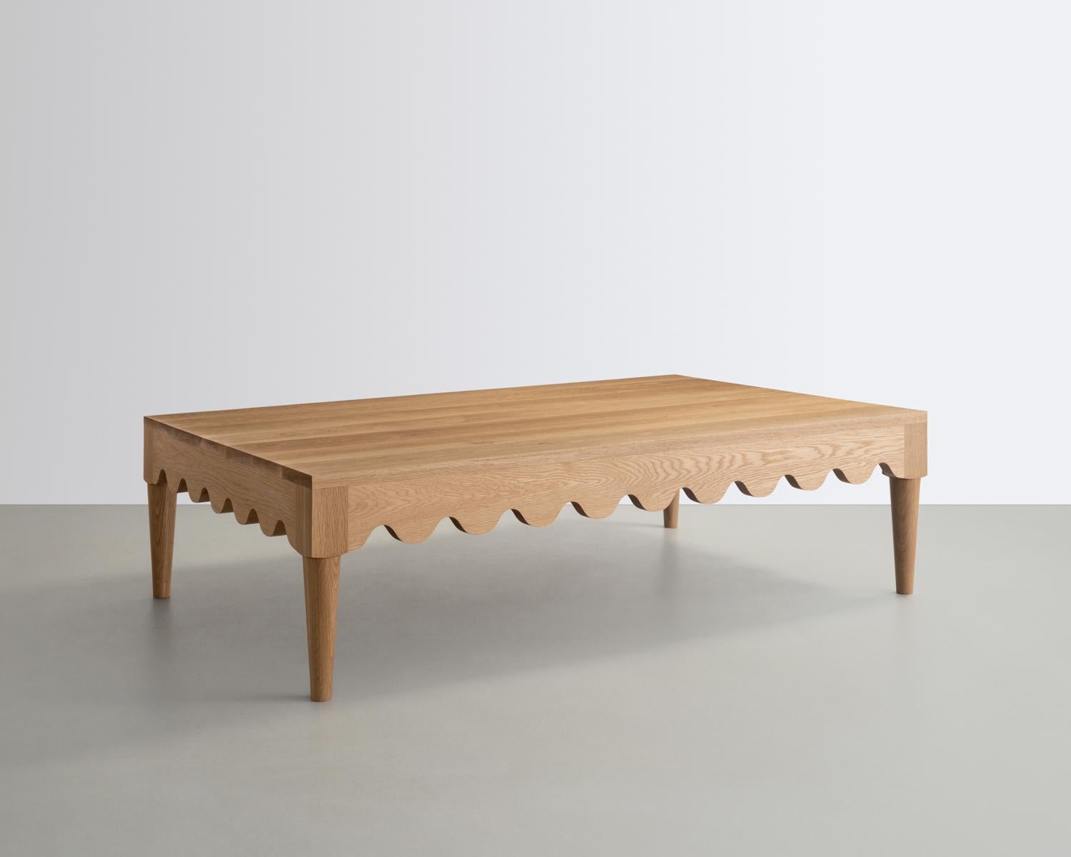 The Squiggle Coffee Table is constructed from solid Oak and features a playful detail that continues along its form. Its Surfaces are finished in a traditional black and white ceruse.
Inspired by the French Mid-century designer Jean Royère.