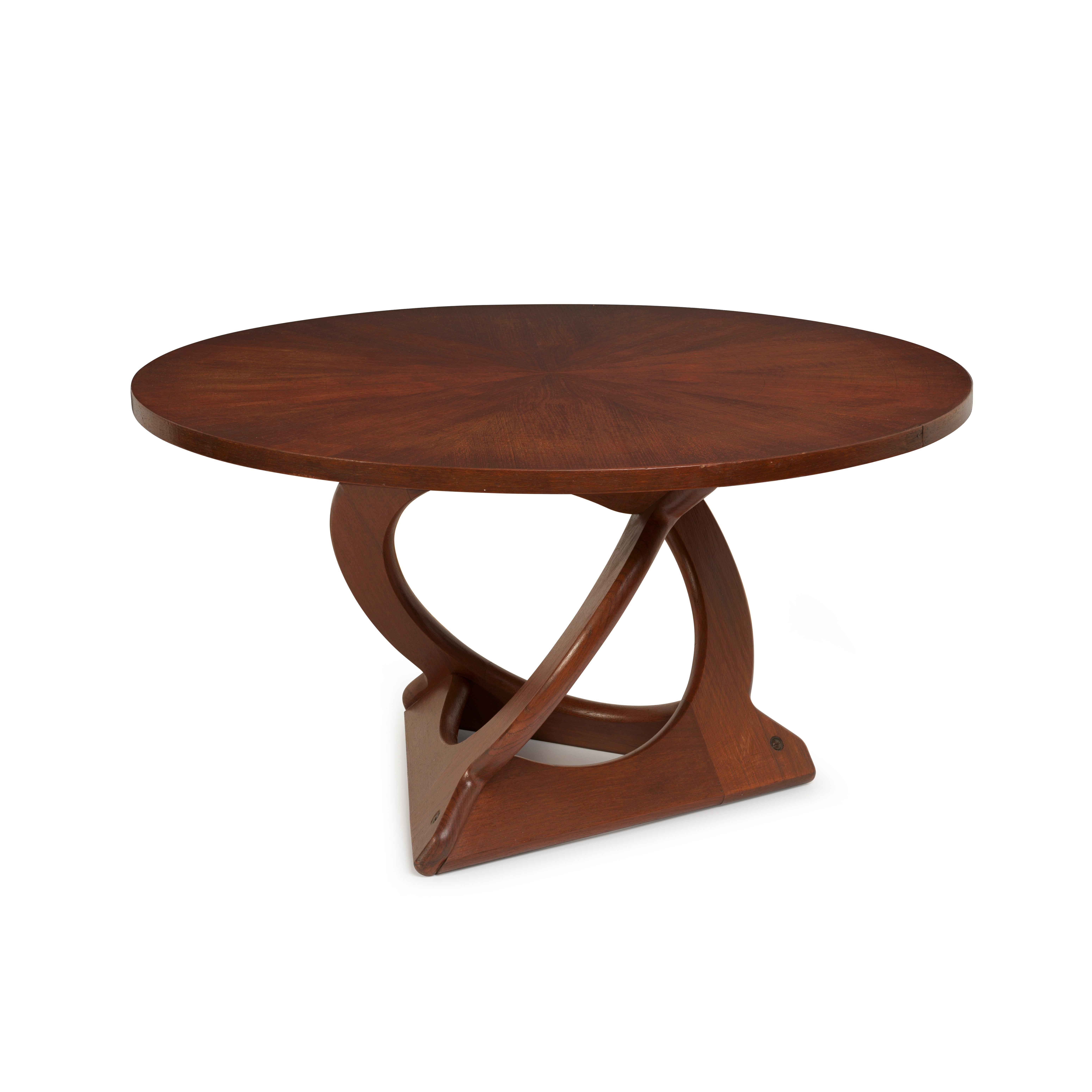 This Danish mid-century modern teak coffee table was designed by the Danish designer, Søren Georg Jensen and produced by Kubus. The design is sculpturally distinctive with intertwining legs that interact with each other in an artistic way,