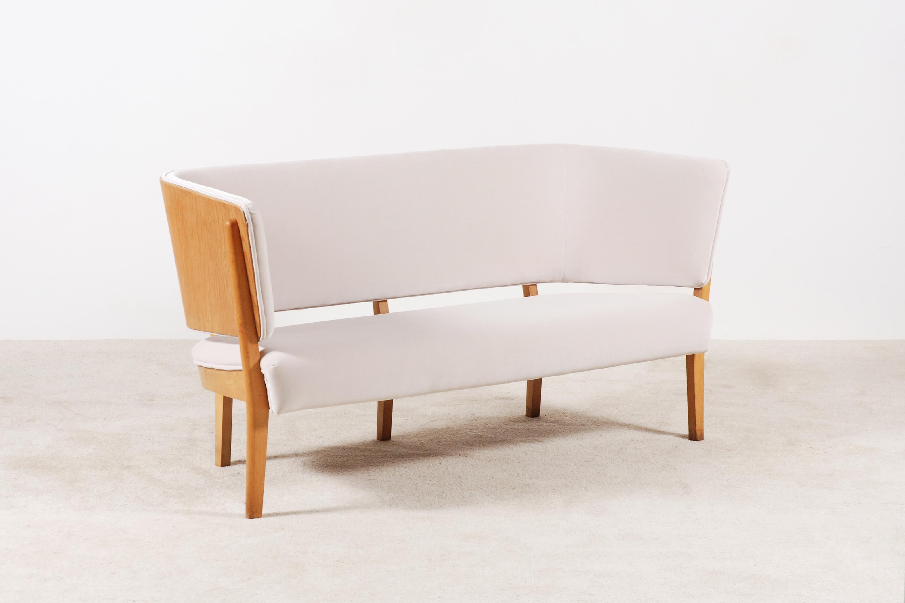 Two-seat sofa, model 2240, made of Beech wood designed by Søren Hansen in 1939 and manufactured by Fritz Hansen. 
A rare find and very collectable piece.
As a sculptural piece, this lovely sofa/bench could find a place in any impressive house,
