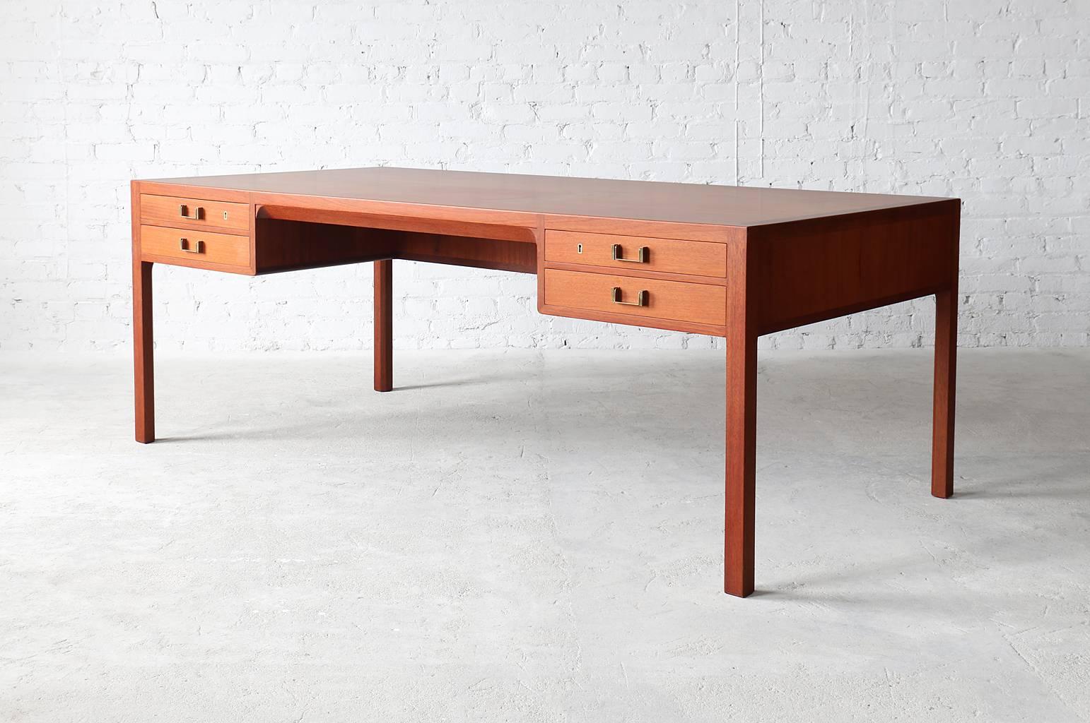 A stunning Danish modern mahogany executive desk designed and manufactured by Søren Horn. Solid mahogany legs and frame along with solid oak drawers joined with dovetails make this an exceptionally well crafted piece. Stamped by Søren Horn.

-