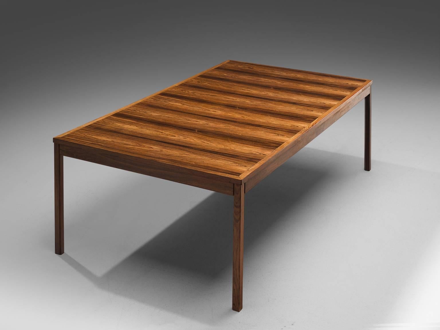 Produced by Søren Willadsen, dining table, rosewood, Denmark, 1960s.

This architectural dining table is produced by Søren Willadsen, as can be seen in the SW logo that is displayed underneath the table. The table is executed in rosewood, the