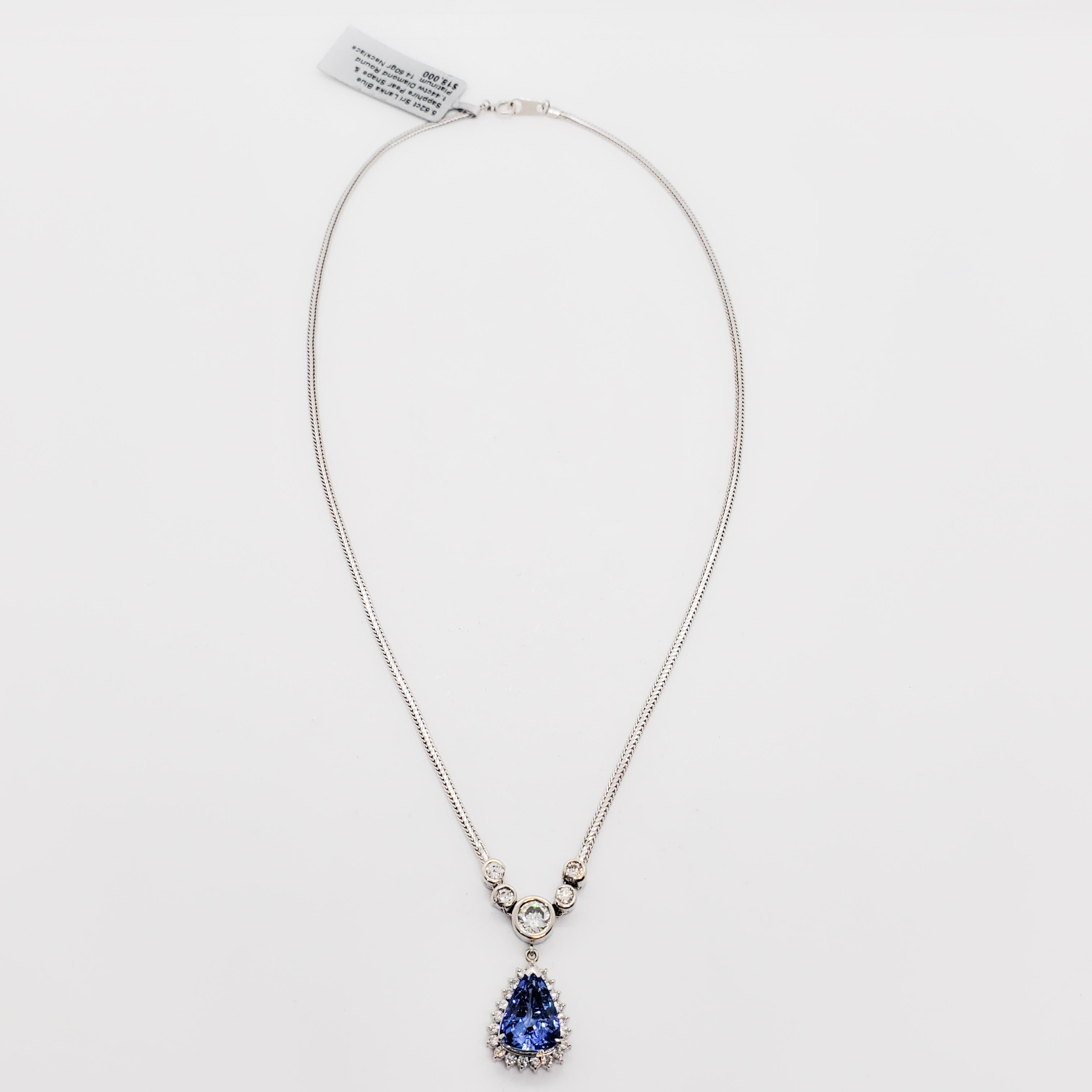 Beautiful Sri Lankan blue sapphire pear shape that weighs 5.62 cts.  Good quality, white, and bright diamond rounds that weigh 1.44 cts.  Handcrafted in platinum.  Attached to aa gorgeous thick platinum chain that gives it a substantial look. 