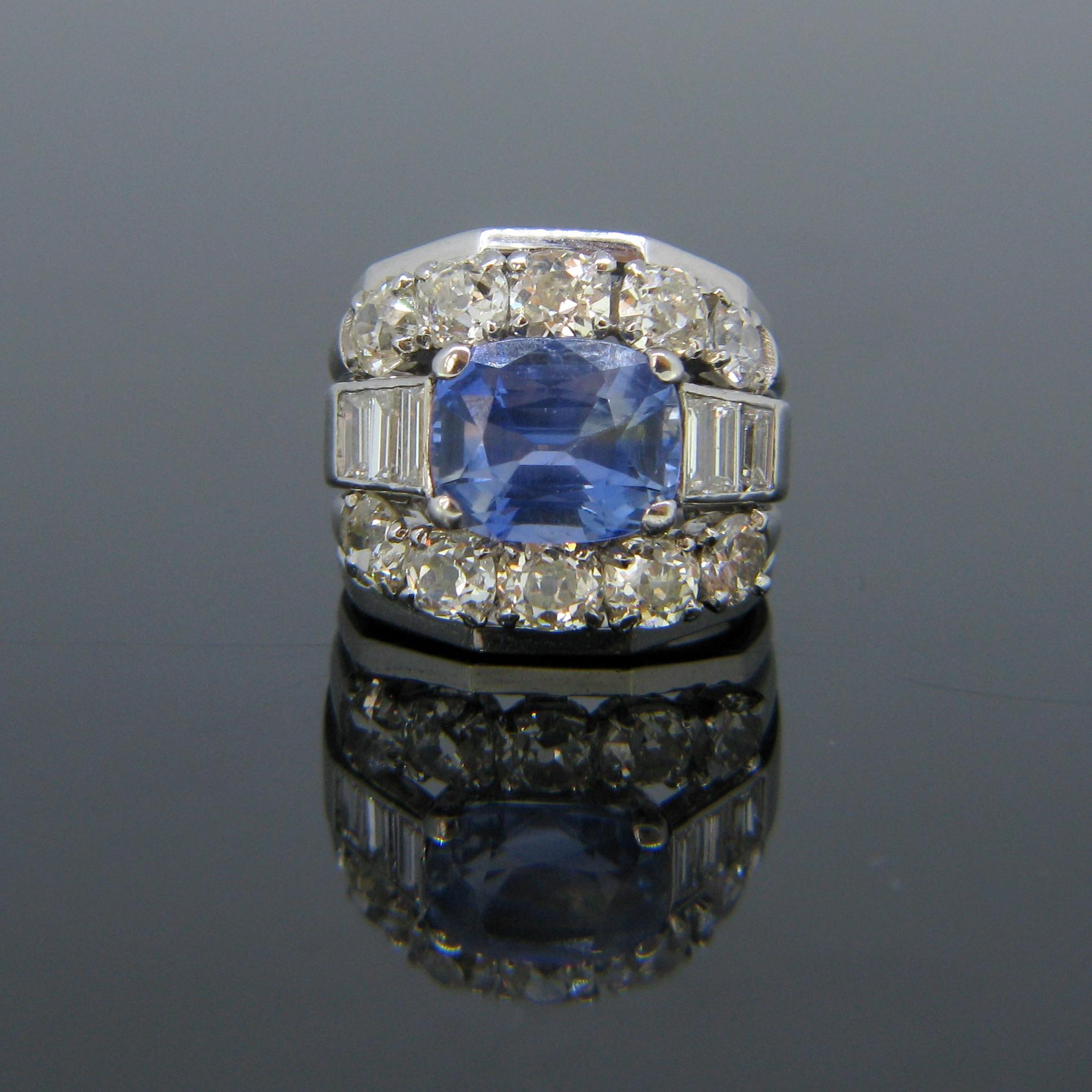 This stunning ring is set with a 4.2ct (approx.) rectangular cushion Ceylon sapphire – it is also adorned with 6 baguette diamonds and 10 old mine cut diamonds. The total diamond carat weight is around 3.5ct.  It is fully made in 18kt white gold.