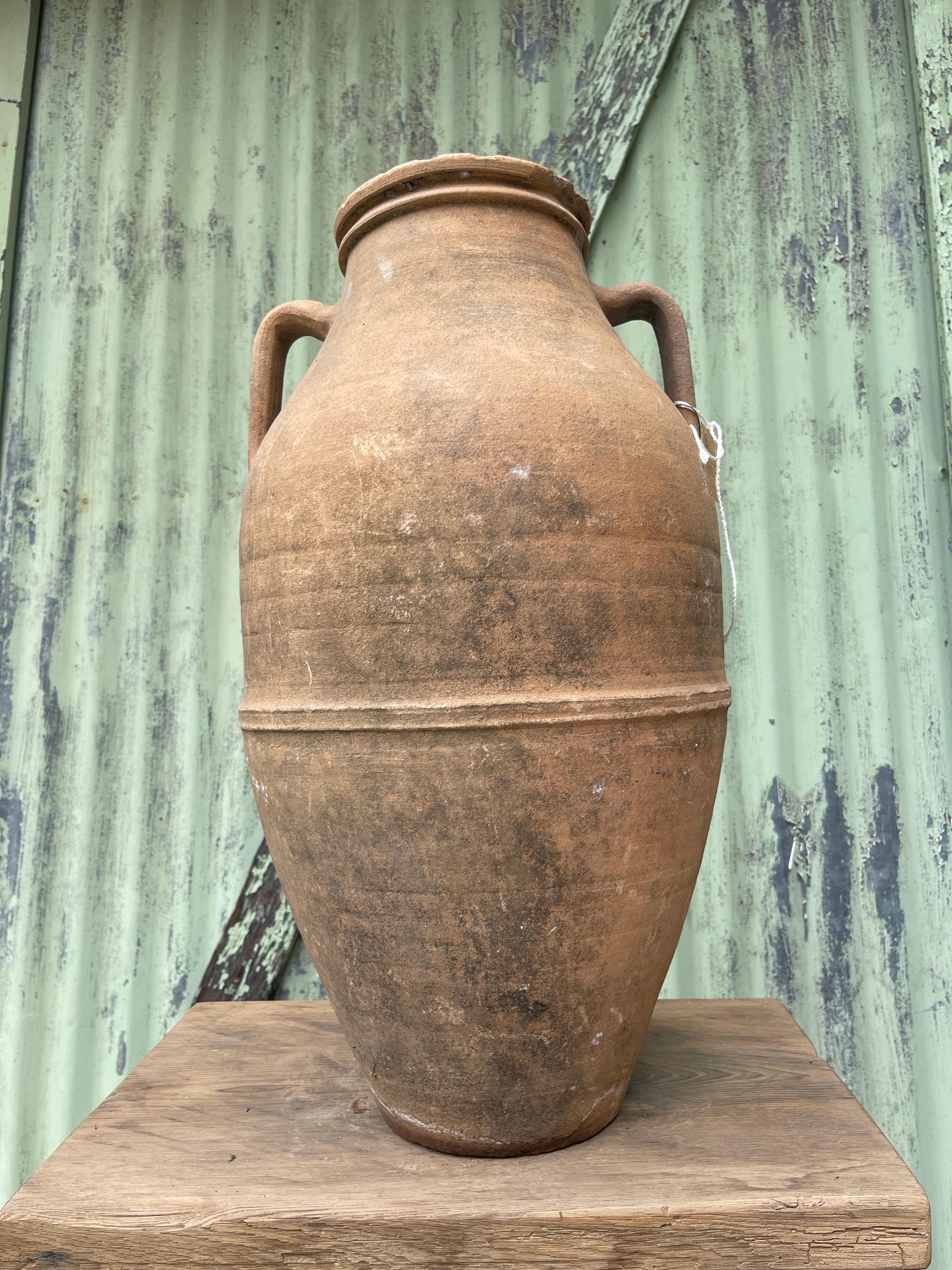 This medium glazed küp was likely used to store cheese by generations of families in the Levant. The design is similar to jugs used to carry water, wine, or other liquids (as cheese is traditionally stored in its brine). Glazing, a traditional