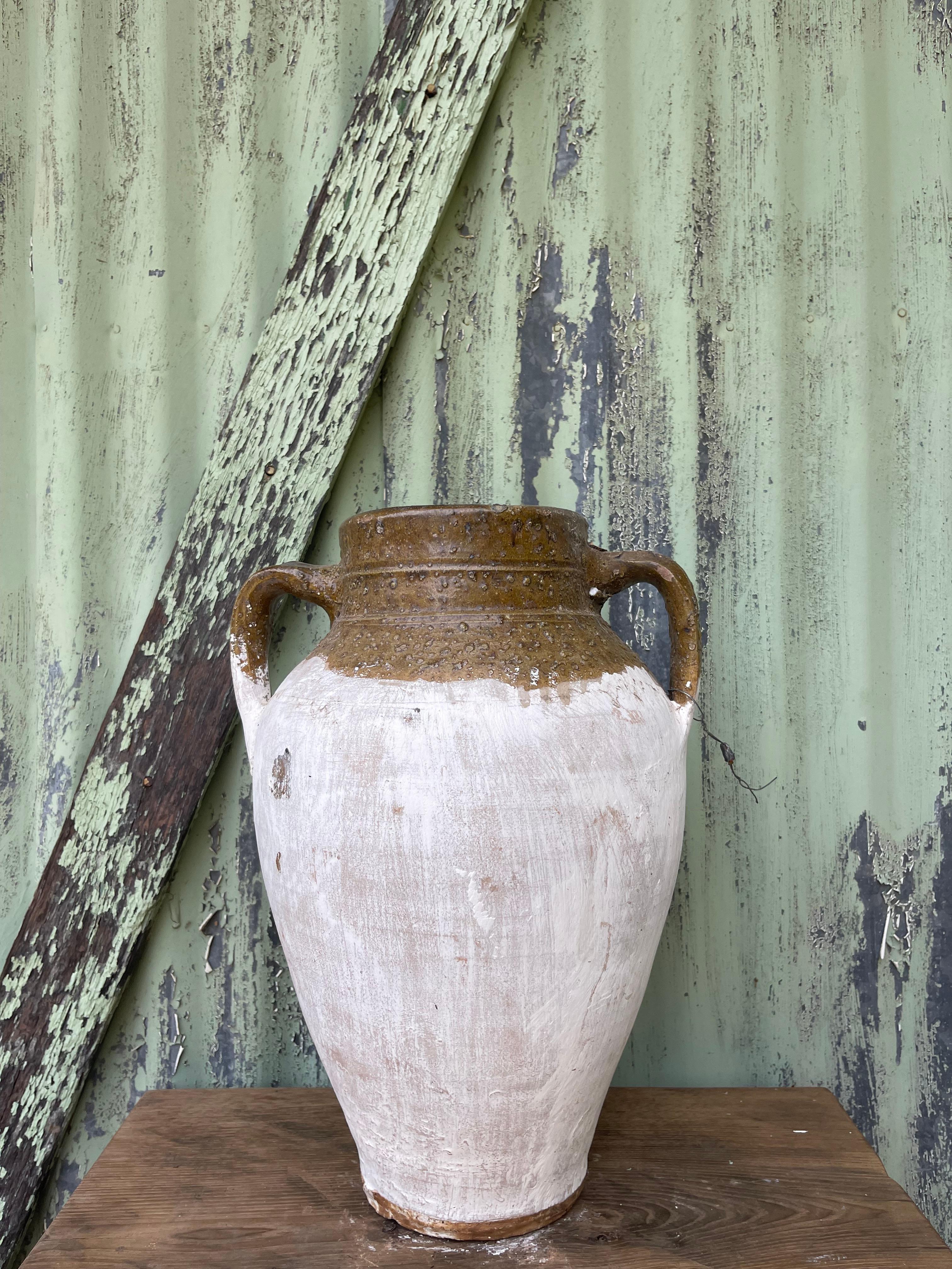This set of medium glazed and limewashed küps was likely used to store cheese by generations of families in the Levant. The design is similar to jugs used to carry water, wine, or other liquids (as cheese is traditionally stored in its brine).