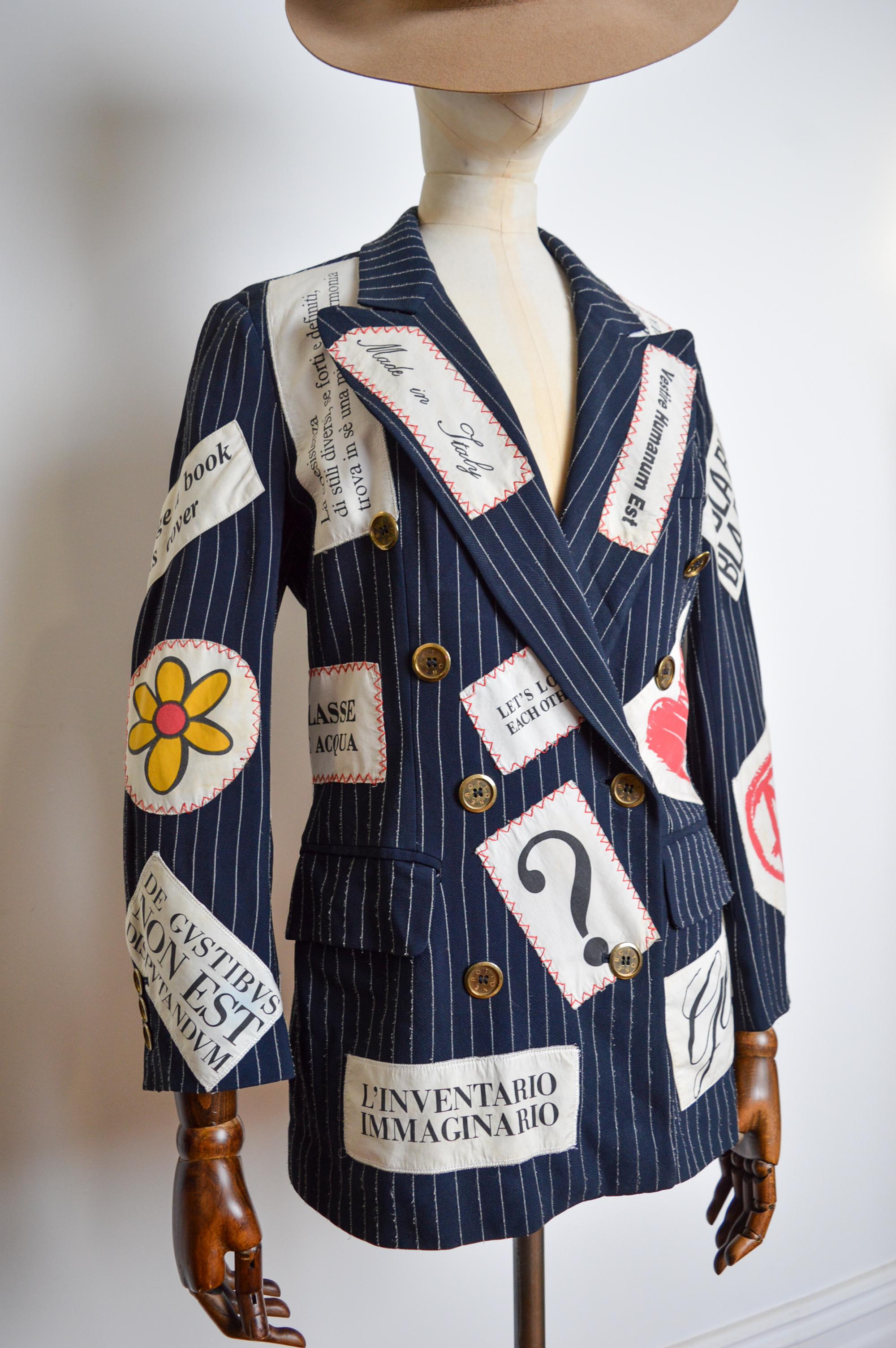 Spring / Summer 1994 MOSCHINO Runway, Hand-sewn Patchwork Blazer Jacket designed by Franco Moschino.

Look 51 / Look 54 Catwalk Reference.

MADE IN ITALY.   

This Superb, Archival Vintage Jacket is crafted from a Pinstriped cloth with Hand-sewn
