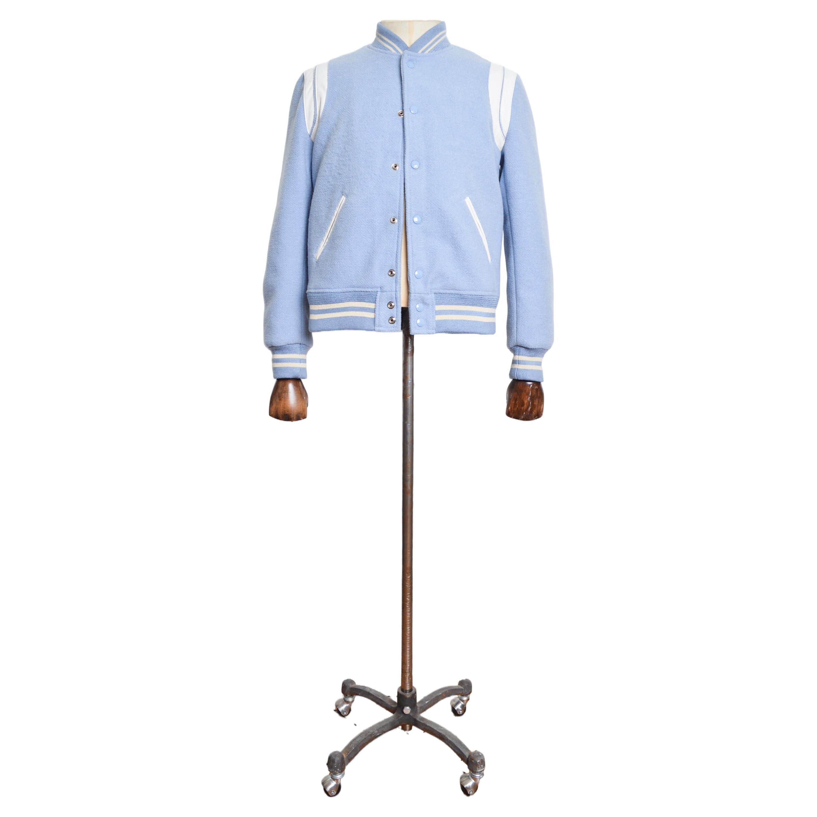 Highly sought after SS/ 2016 SAINT LAURENT baby blue 'Teddy' Bomber jacket.

MADE IN ITALY.  

Features: Rounded neckline, Long sleeves, Press stud closure, elasticated wrist cuffs, collar and waistband, Black acetate interior lining, White lamb