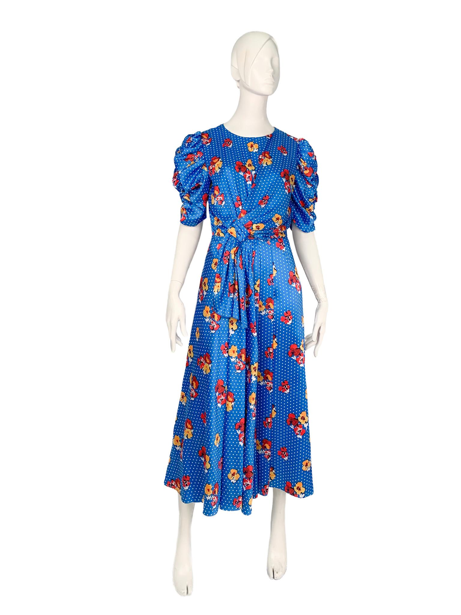 Silk maxi dress with an all-over floral/polka dot pattern, draped ruffled sleeves and decorative knot and tie detail at the front. A beautiful example of Carolina Herrera's outstanding (and widely recognised) mastery in designing sleeves. Retail