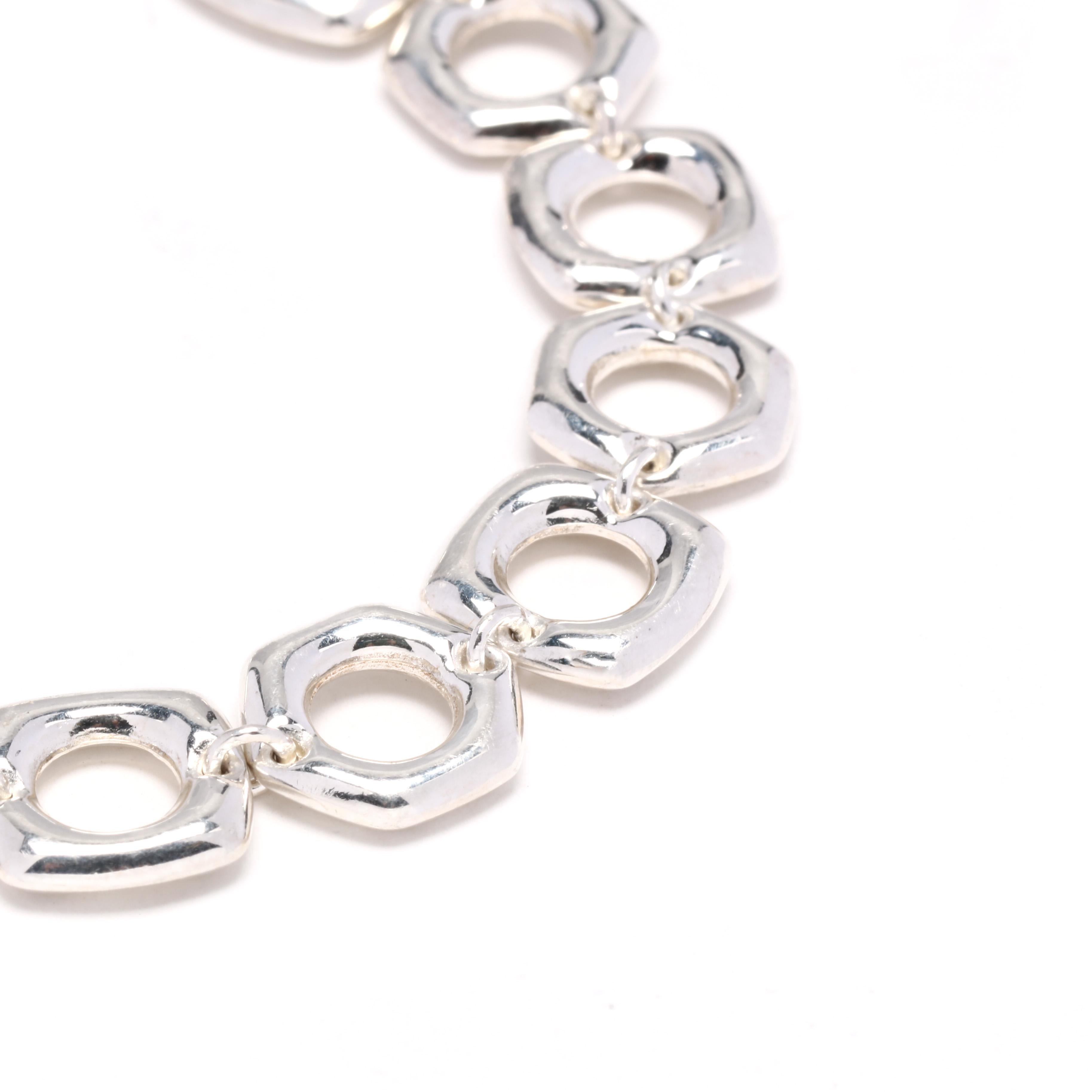 A sterling silver flat square link toggle bracelet. This bracelet features alternating freeform flat square and hexagonal links with a toggle clasp.


Length: 7 in.

Width: 10.75 mm

Weight: 11.8 grams

Ring Sizings & Modifications:
*Please reach
