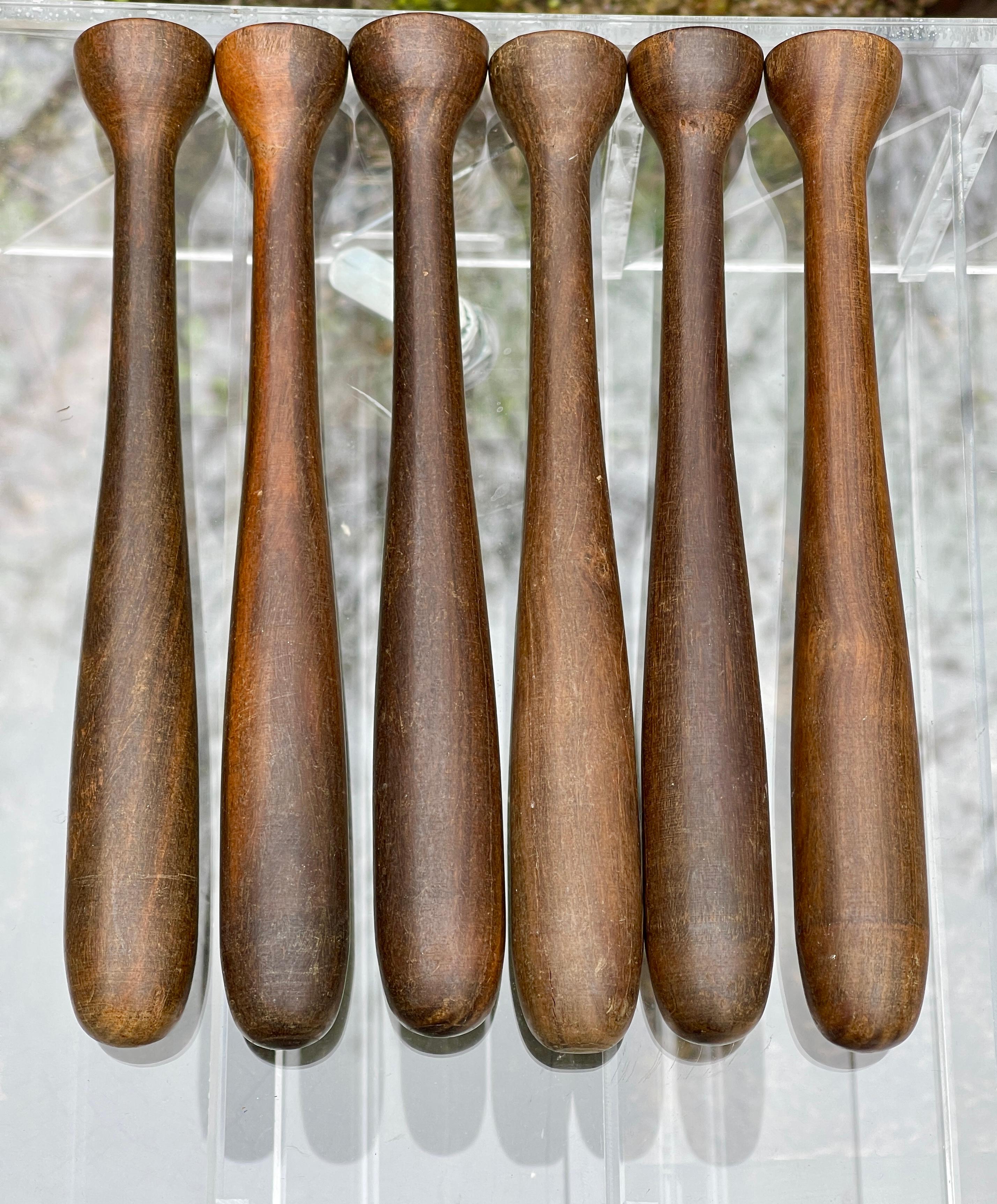 We currently have four of the original Honduran mahogany muddlers, (barware batons for mashing mojitos) from the First Class bar aboard the 1951 ocean liner SS United States. Reputedly these were among the handful of items made of wood to have been
