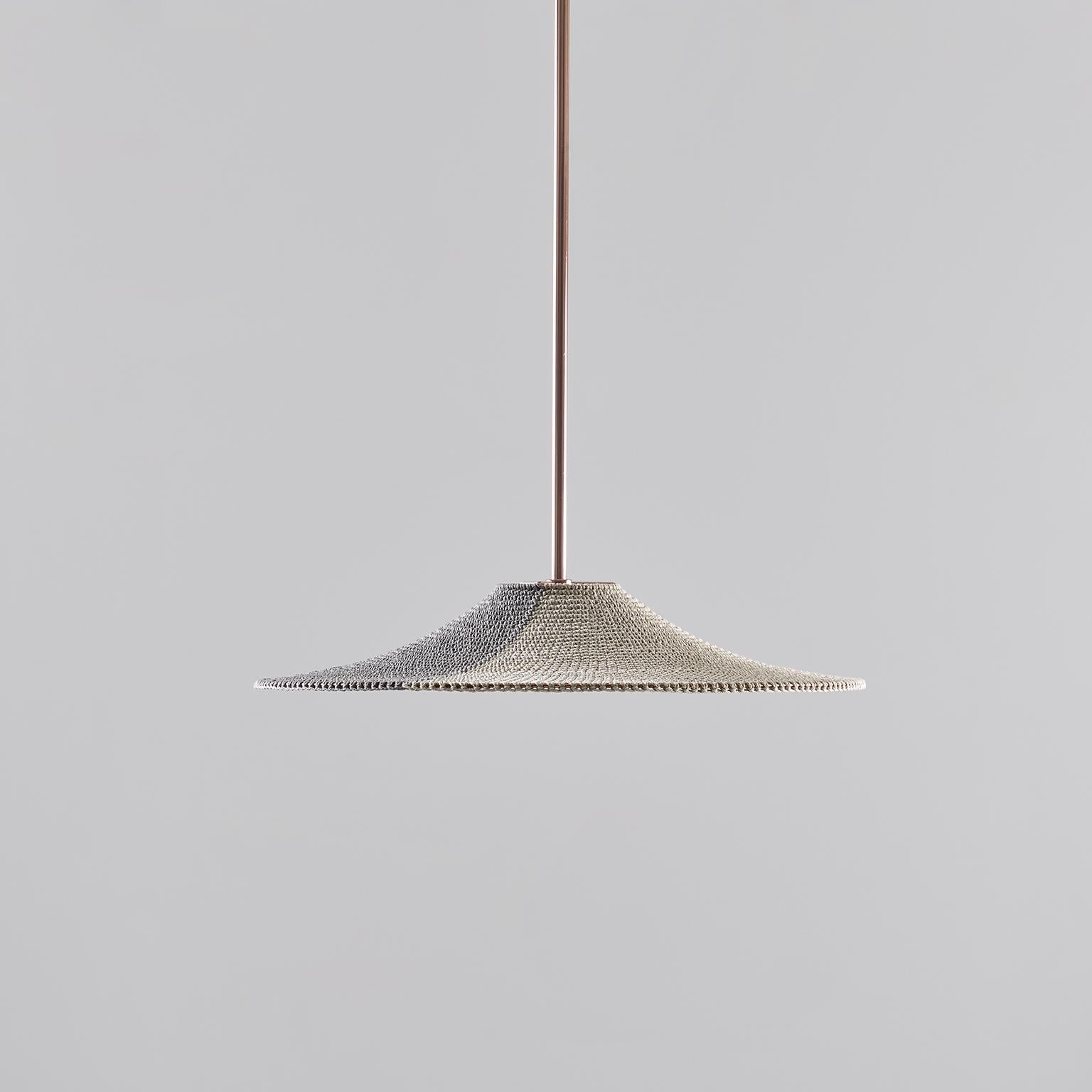 Each Naomi Paul pendant and lighting design is crafted entirely by hand in our London studio to order, by our highly skilled team of makers. 

SS01 makes an elegant centre piece for social spaces and provides a versatile direct overhead light. SS01