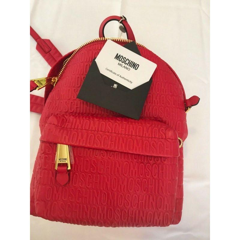 SS17 Moschino Couture Jeremy Scott Red Leather Backpack Wall Over Embossed Logo For Sale 2