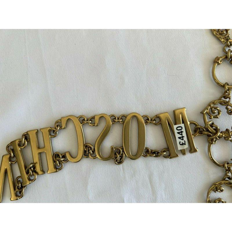 Women's SS19 Moschino Couture Jeremy Scott Logo W/'shrubs on Metal Gate' Gold Dress Belt For Sale