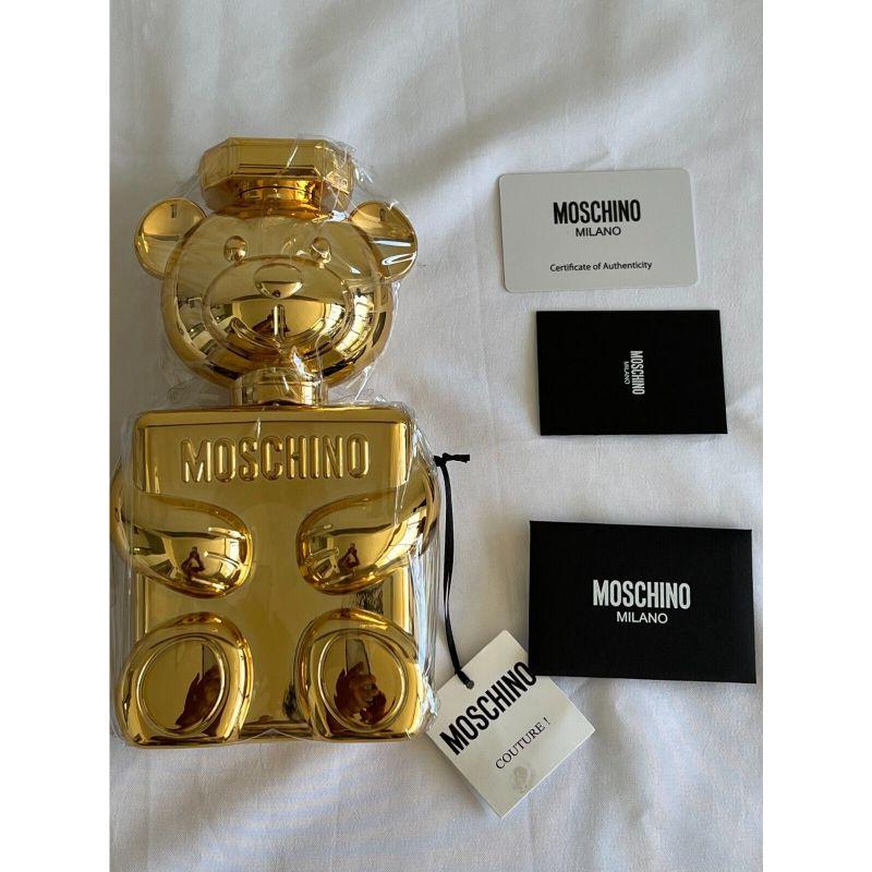 SS19 Moschino Couture Jeremy Scott Teddy Bear Perfume Bottle Shaped Shoulder Bag

Additional Information:
Material: Acrylic
Color: Gold
Finish: Metallic
Pattern: Perfume Teddy Bear Bottle Shape
Style: Crossbody
Year Manufactured: 2018
Dimension: 4.5