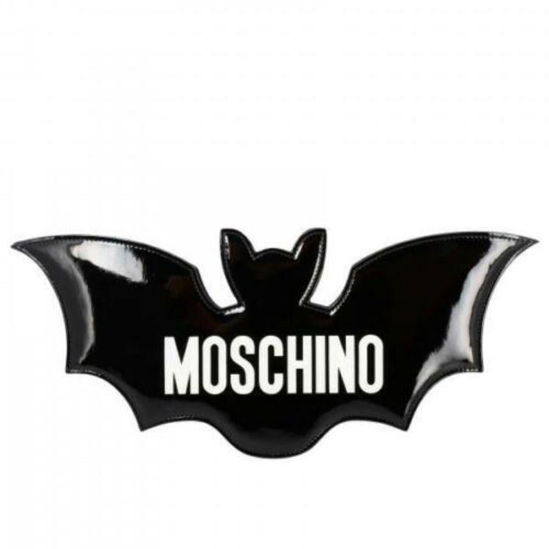SS20 Moschino Couture Jeremy Scott Shiny Black Bat Bag Halloween Trick or Chic

Additional Information:
Material: 60% Polyurethane, 20% Polyester, 20% Cotton
Color: Black/White
Pattern: Bat
Style: Shoulder Bag
Size: Medium
Dimension: 13 W x 1.5 D x