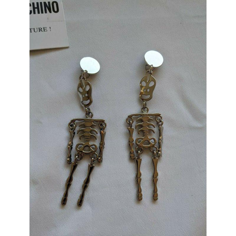 SS20 Moschino Couture Jeremy Scott Skeleton Silver Clip on Earrings 'Trick/Chic'

Additional Information:
Material: Metal
Color: Silver
Pattern: Skeleton
Style: Clip
Theme: Skeletons & Skulls
100% Authentic!!!
Condition: Brand new, original Moschino