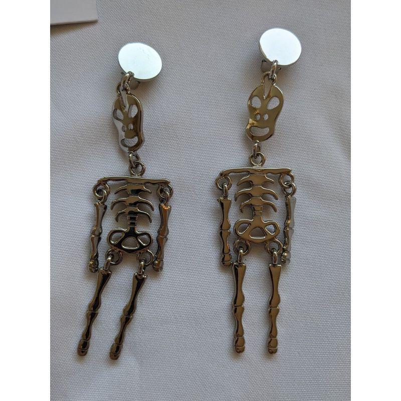 Modern SS20 Moschino Couture Jeremy Scott Skeleton Silver Clip on Earrings 'Trick/Chic' For Sale