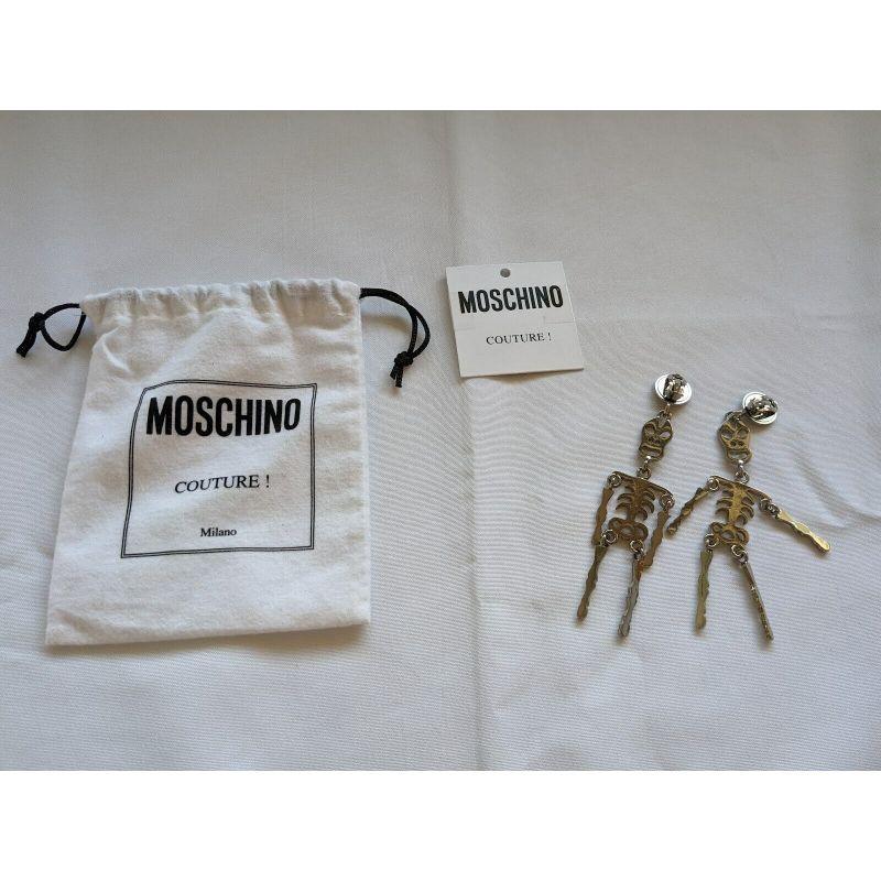 SS20 Moschino Couture Jeremy Scott Skeleton Silver Clip on Earrings 'Trick/Chic' In New Condition For Sale In Palm Springs, CA