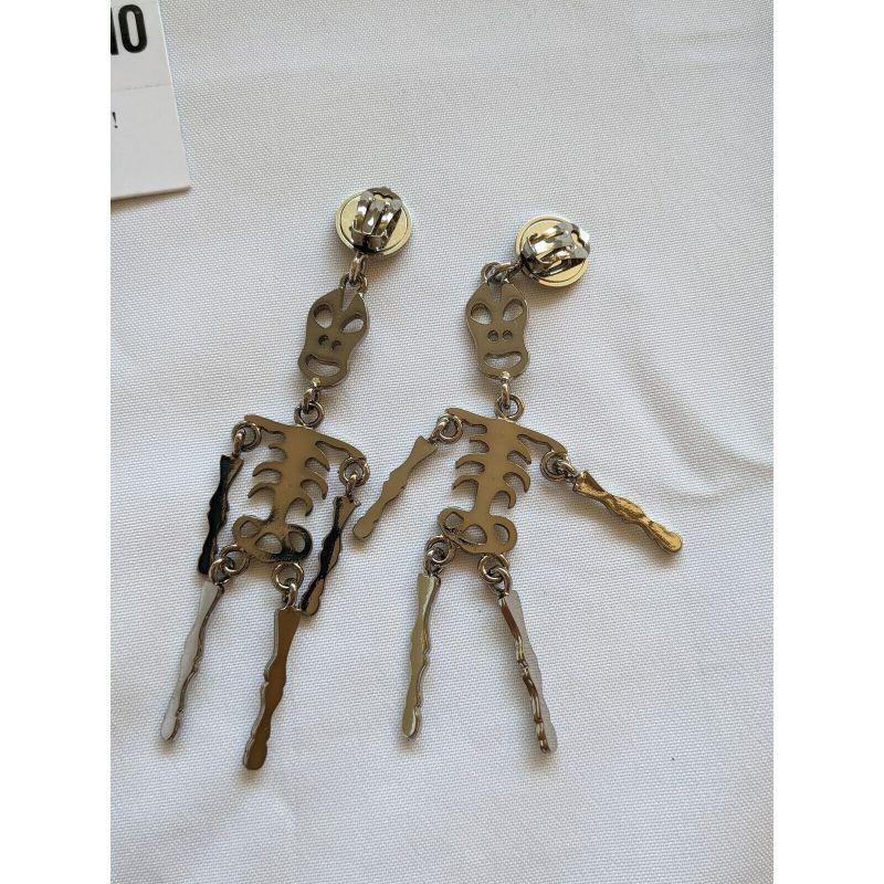 Women's SS20 Moschino Couture Jeremy Scott Skeleton Silver Clip on Earrings 'Trick/Chic' For Sale