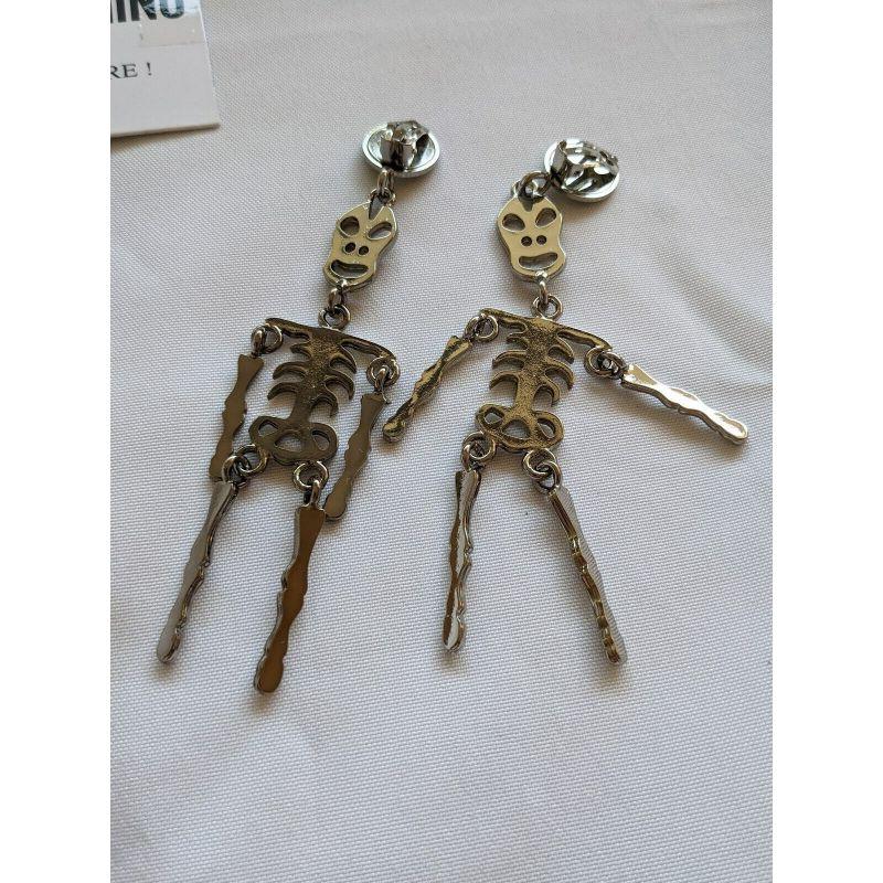 SS20 Moschino Couture Jeremy Scott Skeleton Silver Clip on Earrings 'Trick/Chic' For Sale 1