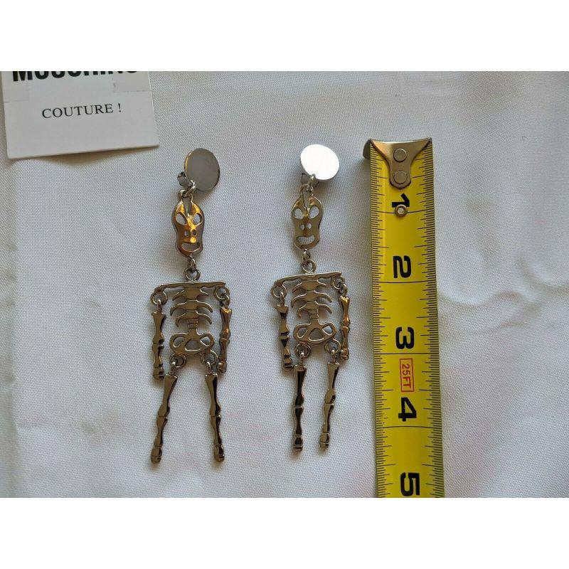 SS20 Moschino Couture Jeremy Scott Skeleton Silver Clip on Earrings 'Trick/Chic' For Sale 4