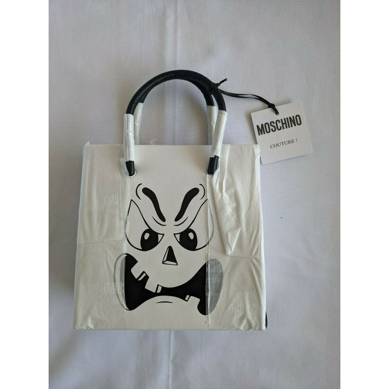 SS20 Moschino Couture Jeremy Scott White Pumpkin Face Leather Shopper Trickchic

Additional Information:
Material: Leather
Color: White/Black
Pattern: Pumpkin Face
Style: Shopper
Dimension: 6.25 W x 3 D x 6.5 H in
Theme: Halloween
100%