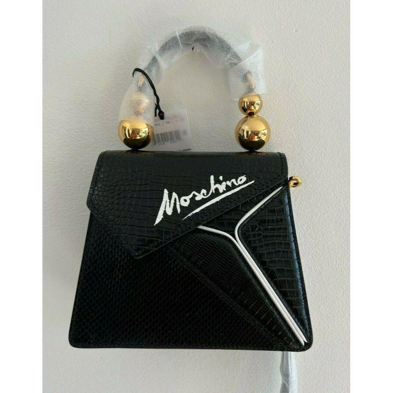 SS20 Moschino Couture Picasso Black Leather Cubism Snakeskin Leather Shoulder Bag

Additional Information:
Material: Leather
Color: Black/White/Gold
Pattern: Geometric
Style: Shoulder Bag
Size: Medium
Dimension: 9 W x 3.5 D x 7 H in
100%