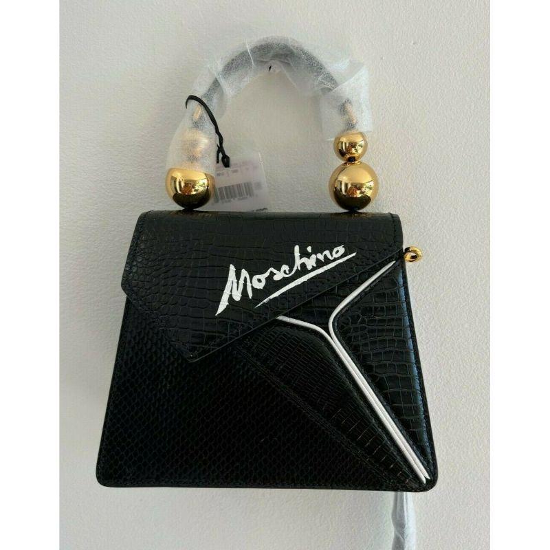 SS20 Moschino Couture Picasso Negro Piel Cubismo Piel de serpiente Bolso de hombro

Información adicional:
Material: Piel
Color: Negro/Blanco/Oro
Patrón: Geométrico
Estilo: Bolso de hombro
Talla: Mediana
Dimensión: 9 A x 3,5 P x 7 A pulg.
¡¡¡100%